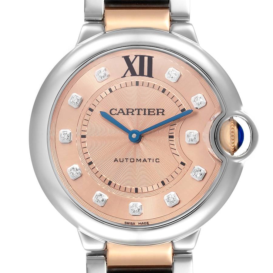 The Cartier Ballon Bleu WE902054 Women's Steel and Gold (two tone) Pink Dial watch is shown from a front angle, highlighting the dial, hands, and crown.