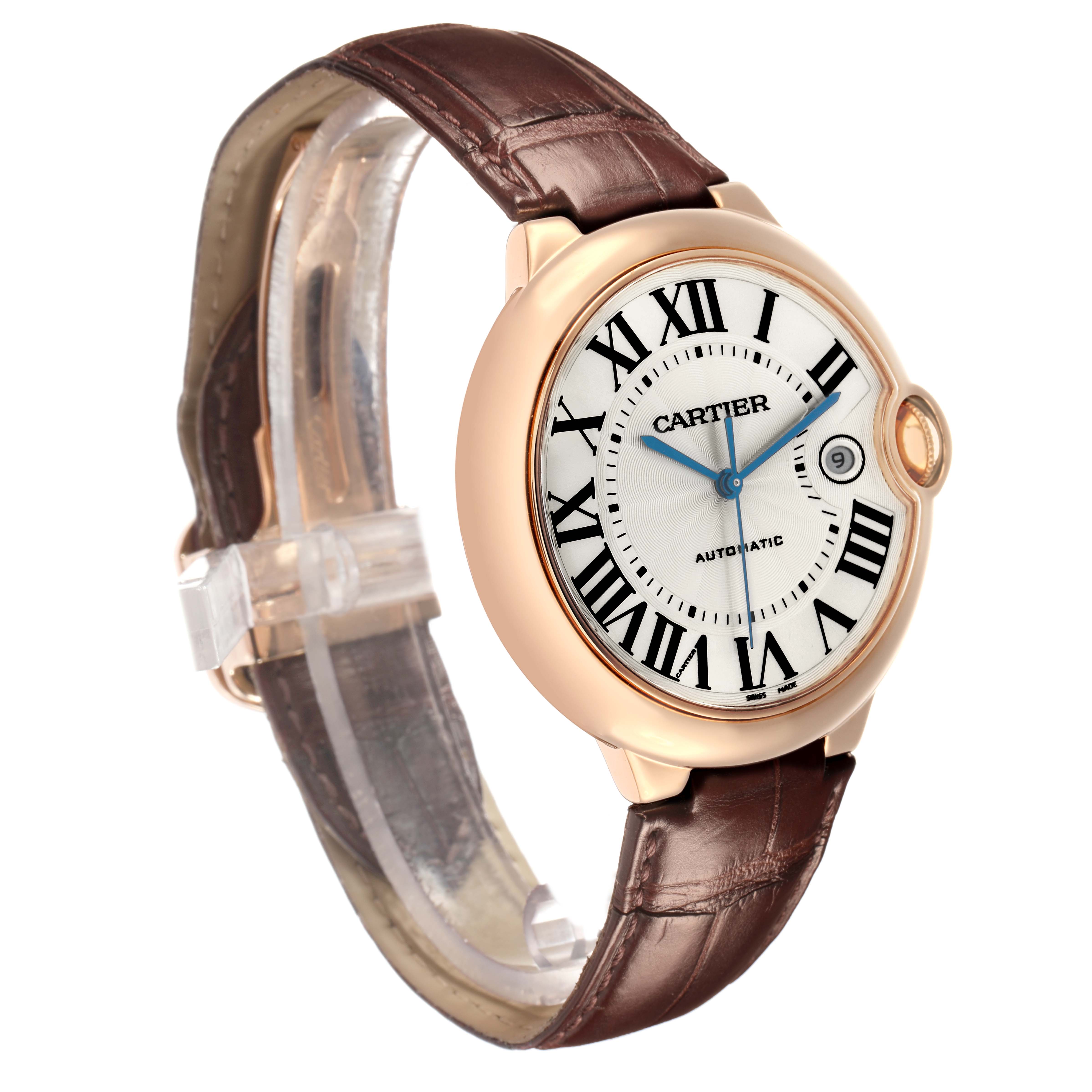The Ballon Bleu de Cartier watch is shown at a three-quarter angle, displaying the face, crown, and leather strap.