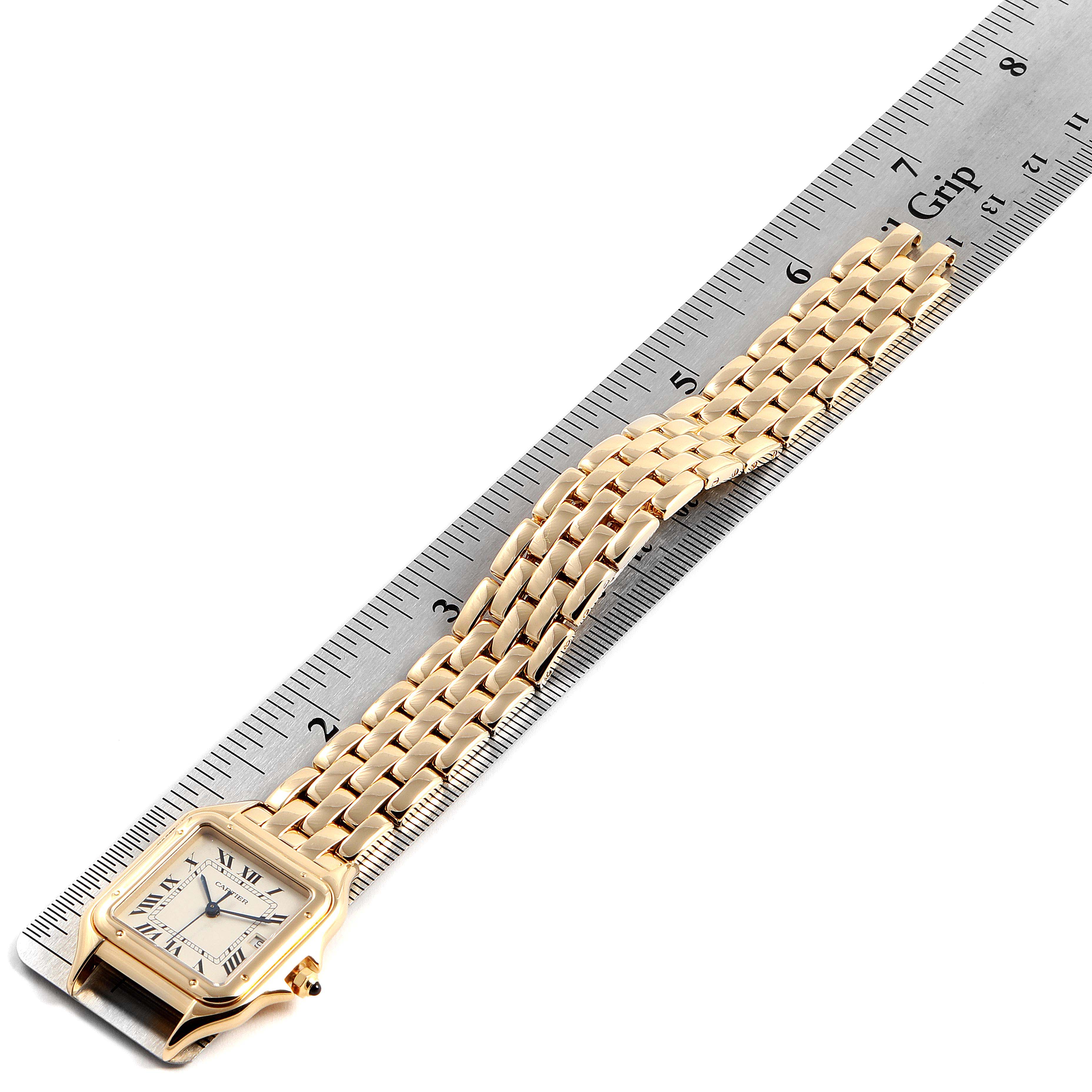 The image shows a Cartier Panthere W25014B9 Women's Yellow Gold Silver Dial W25014B9 Women's Yellow Gold Silver Dial model watch face and bracelet laid next to a ruler for measurement.