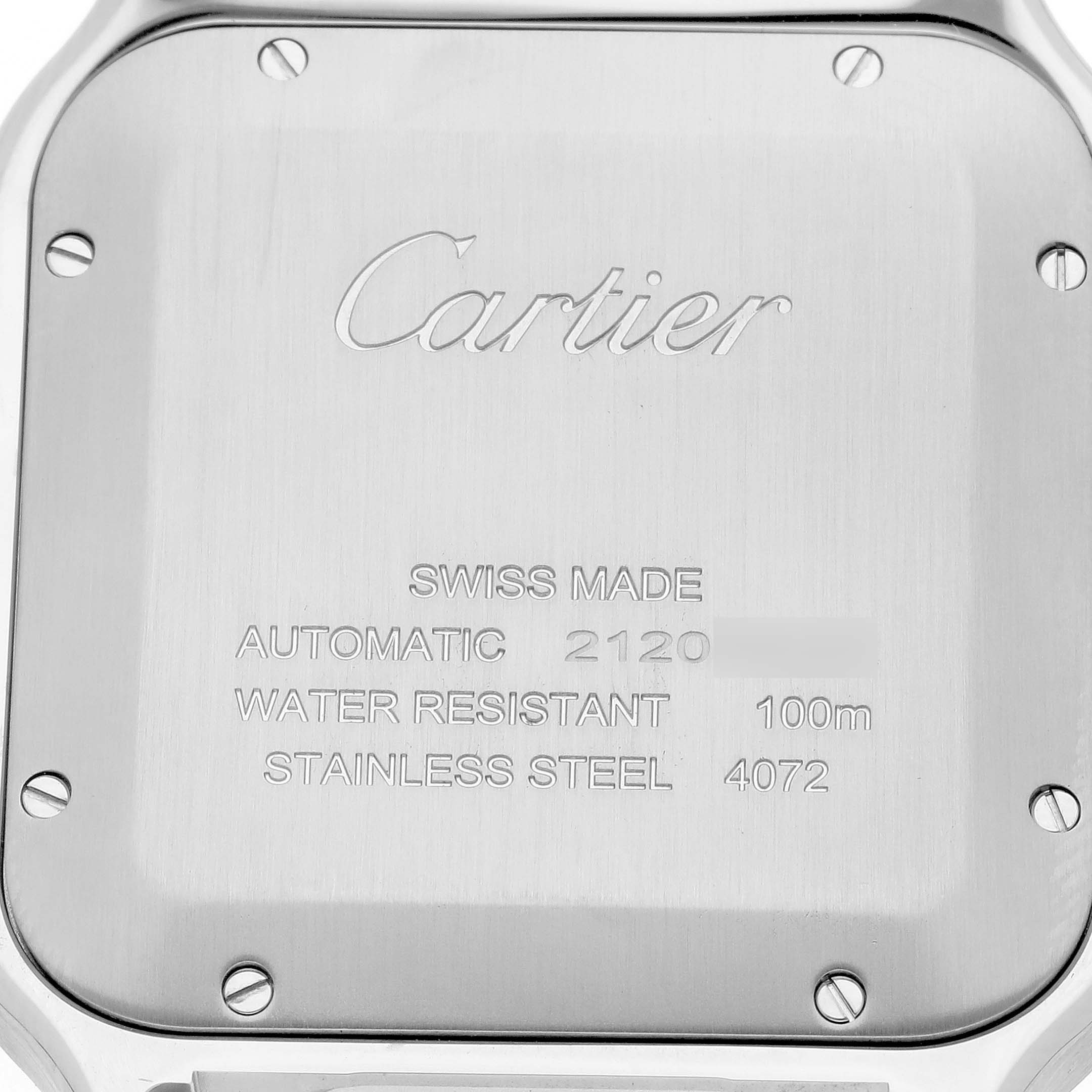 The image shows the back case of a Cartier Santos WSSA0018 Men
s Stainless Steel Silver Dial WSSA0018 Men
s Stainless Steel Silver Dial watch with engravings and screws visible.