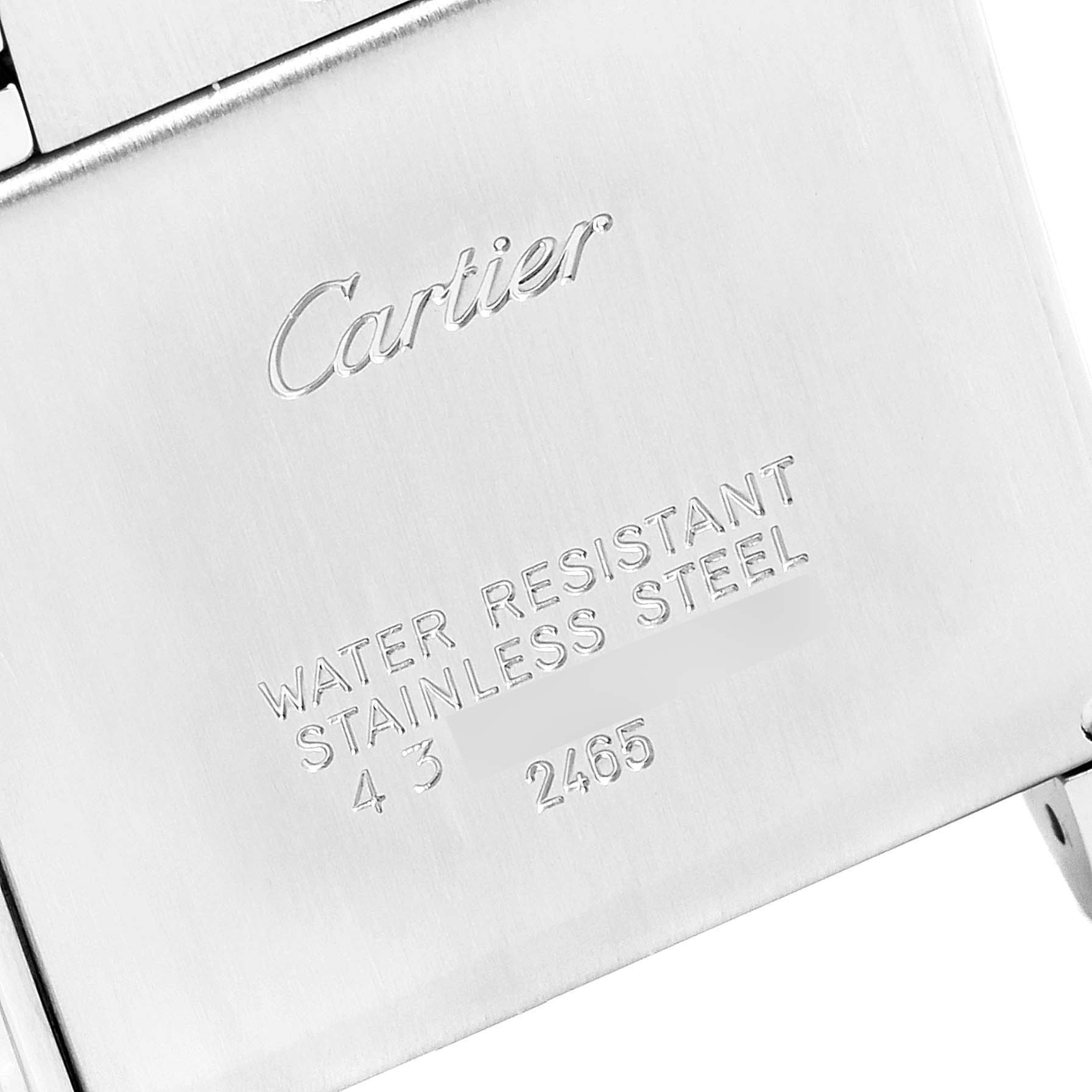 The image shows the engraved stainless steel back of a Cartier Tank Francaise W51012Q4 Women's Steel and Gold (two tone) Silver Dial W51012Q4 Women's Steel and Gold (two tone) Silver Dial watch.