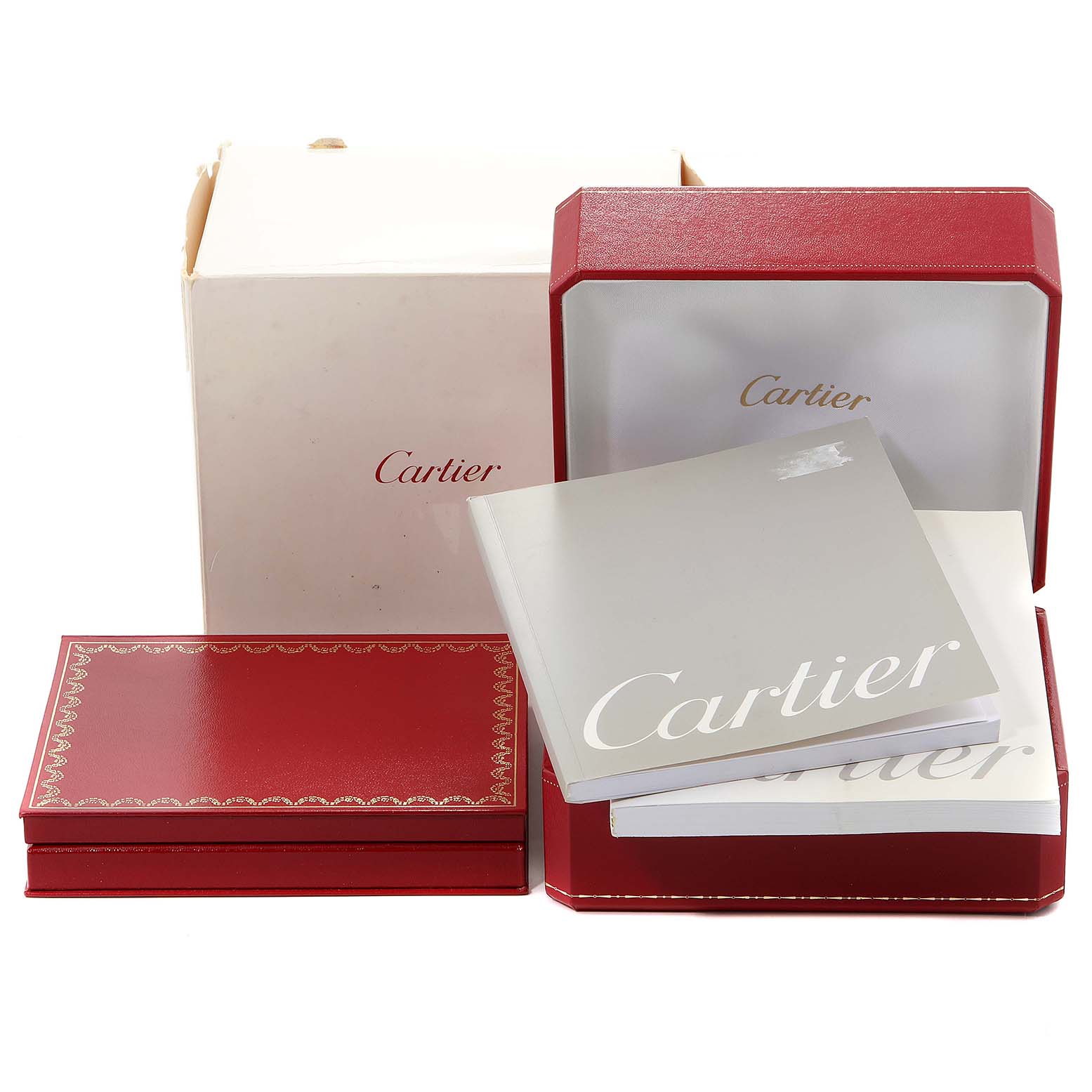 The image shows the packaging and booklet of a Cartier Tank Française watch, including a red presentation box, outer box, and documentation.