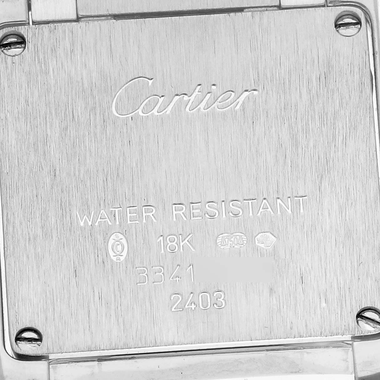The image shows the back case of a Cartier Tank Française watch, highlighting the brand engraving and water resistance details.