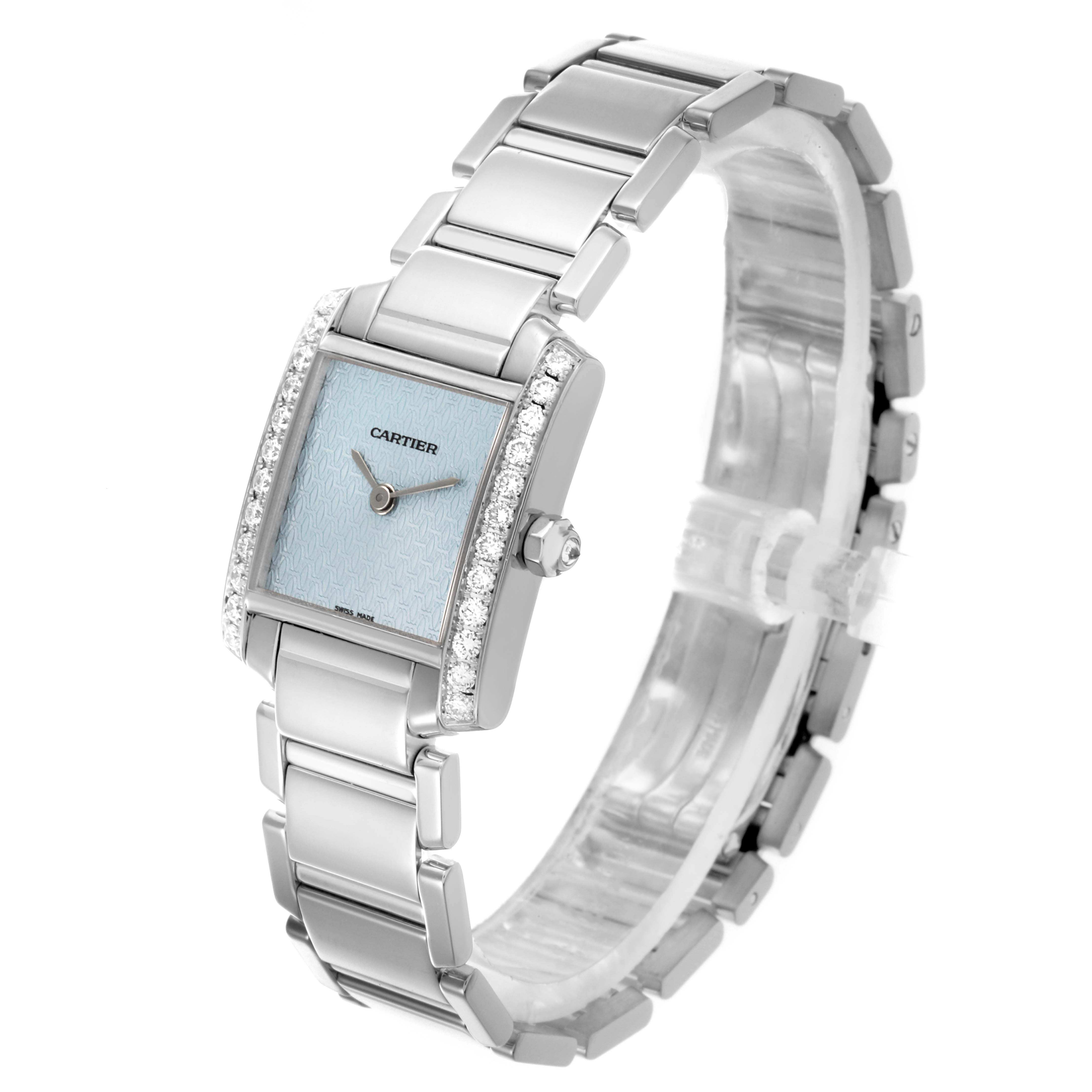 The Cartier Tank Française watch is shown at an angle highlighting its bracelet, bezel, and blue dial.