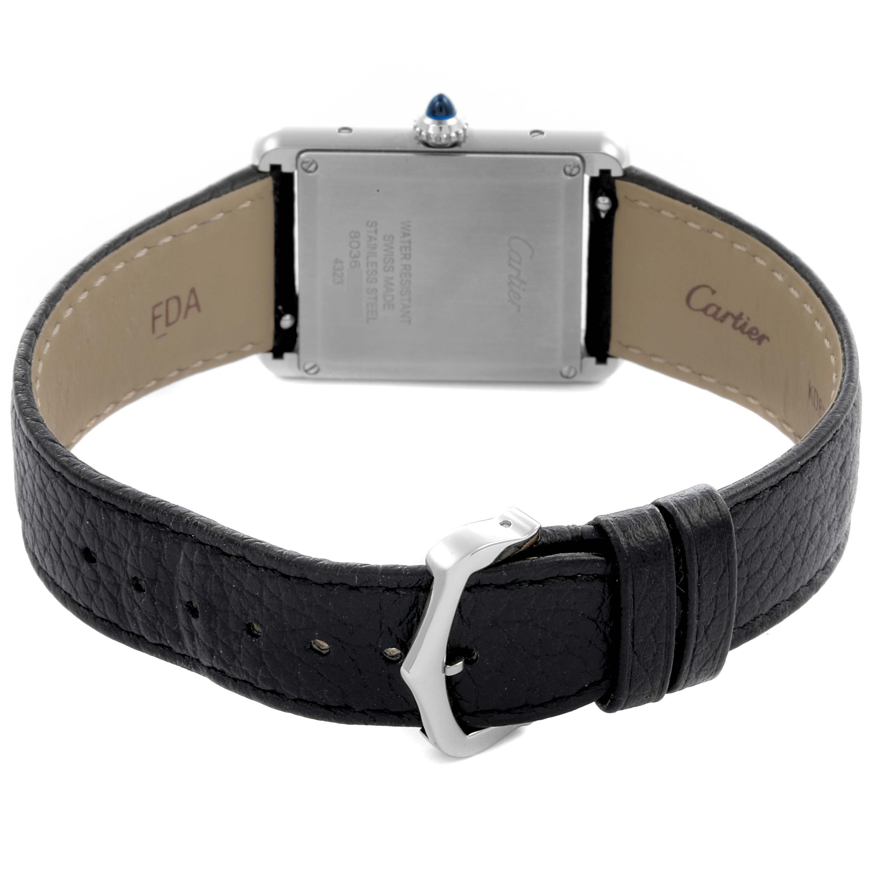 The Cartier Tank Must WSTA0041 Women
s Stainless Steel Silver Dial WSTA0041 Women
s Stainless Steel Silver Dial watch is shown from the back, highlighting the case back, strap, and buckle.