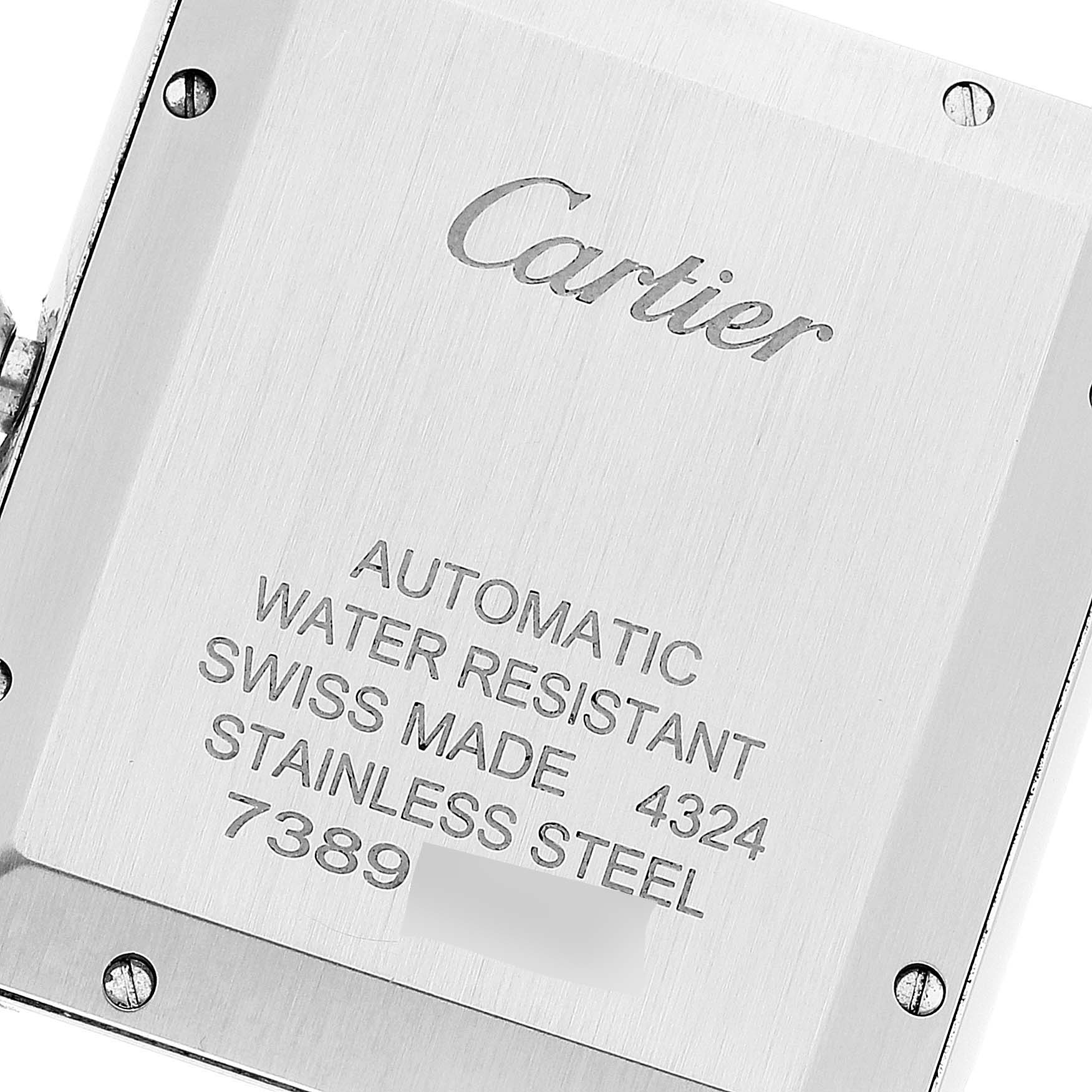 This image shows the back case of a Cartier Tank Must WSTA0040 Men
s Stainless Steel Silver Dial WSTA0040 Men
s Stainless Steel Silver Dial watch, showcasing its engravings and screws.