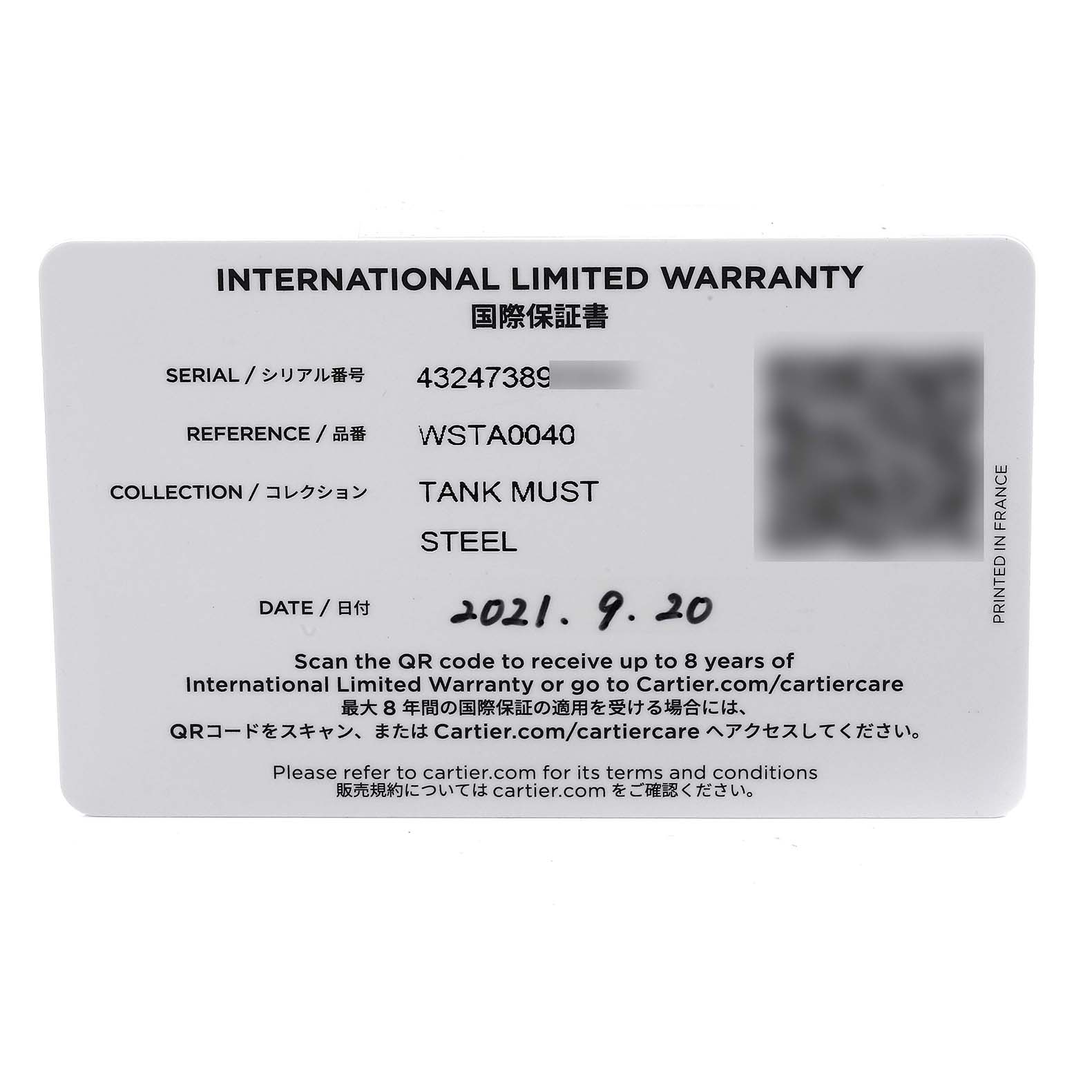 The image shows an international limited warranty card for the Cartier Tank Must WSTA0040 Men
s Stainless Steel Silver Dial WSTA0040 Men
s Stainless Steel Silver Dial model watch.