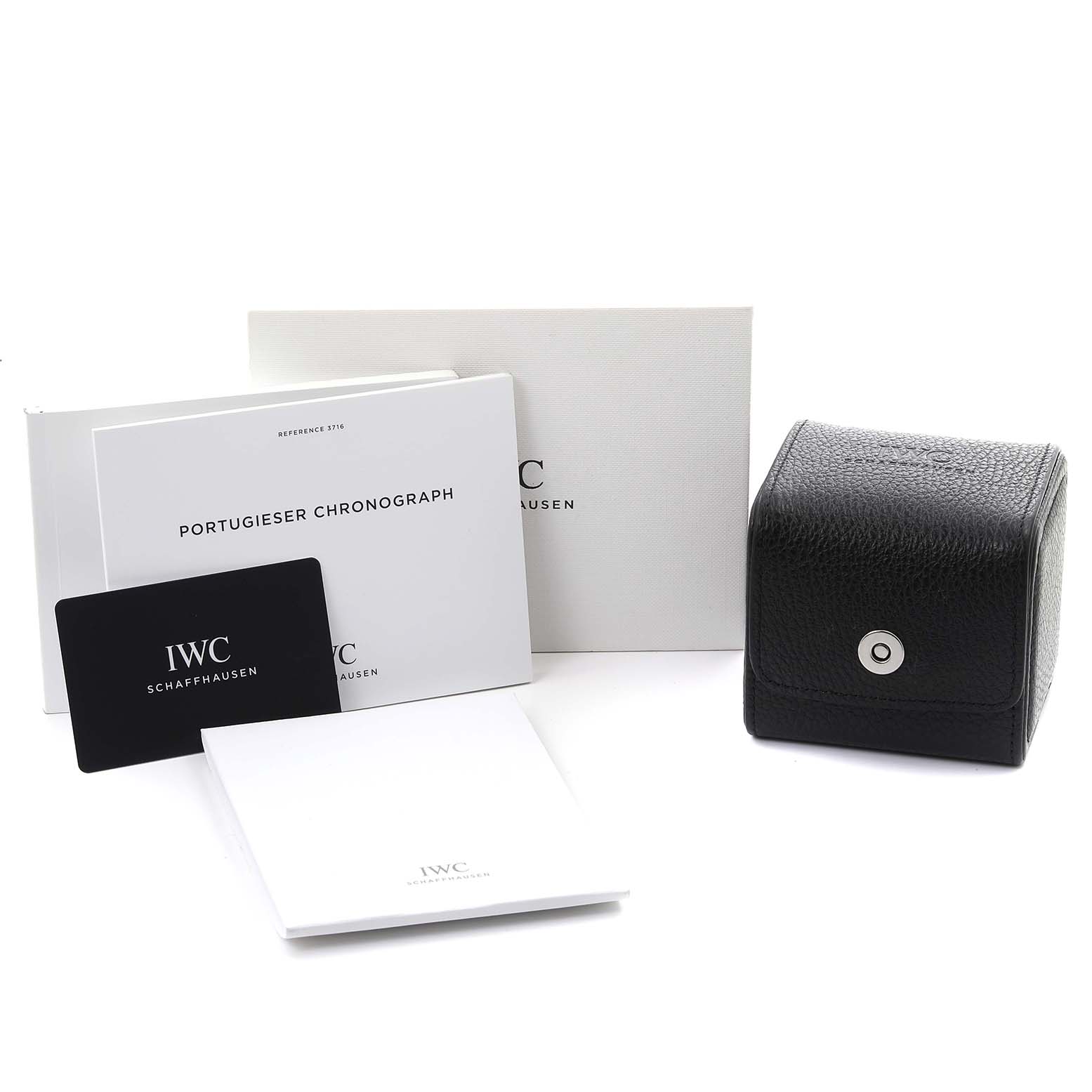 The image shows accessories for the IWC Pilot IW371815 Men
s Ceramic Black Dial IW371815 Men
s Ceramic Black Dial model including a black box, manuals, and certification cards.