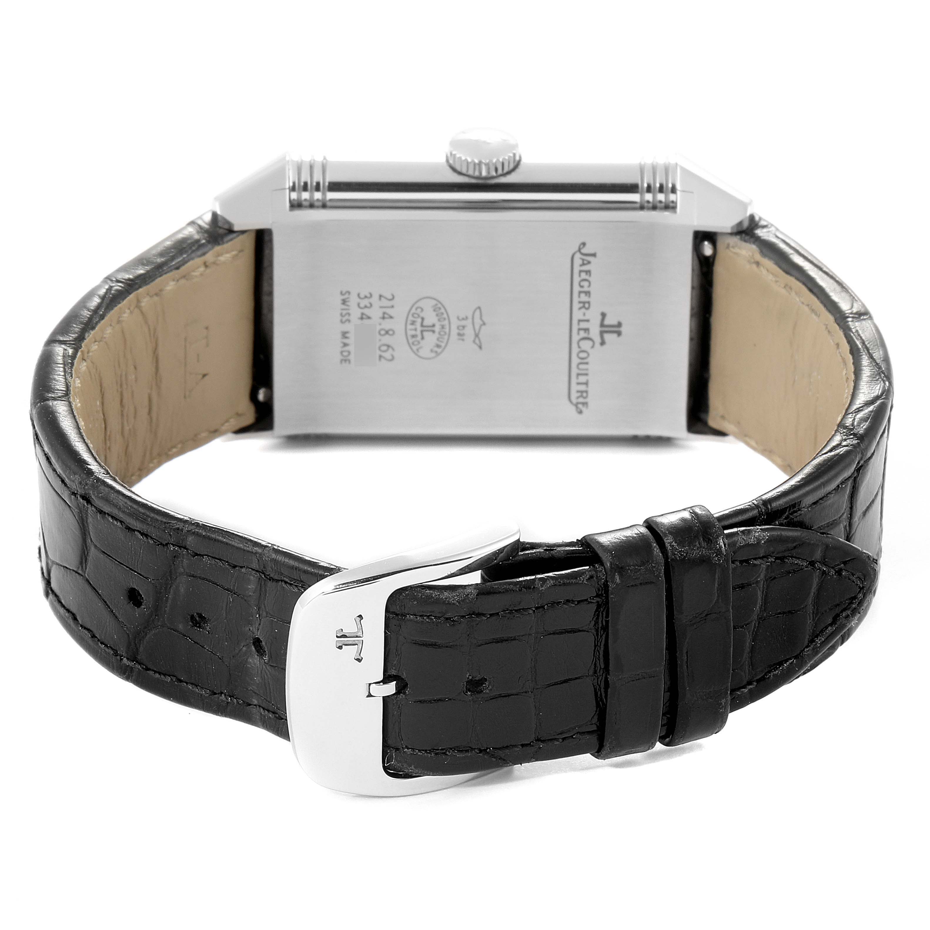 The image shows the back and buckle of a Jaeger-LeCoultre Reverso watch, with the strap and case back in clear view.