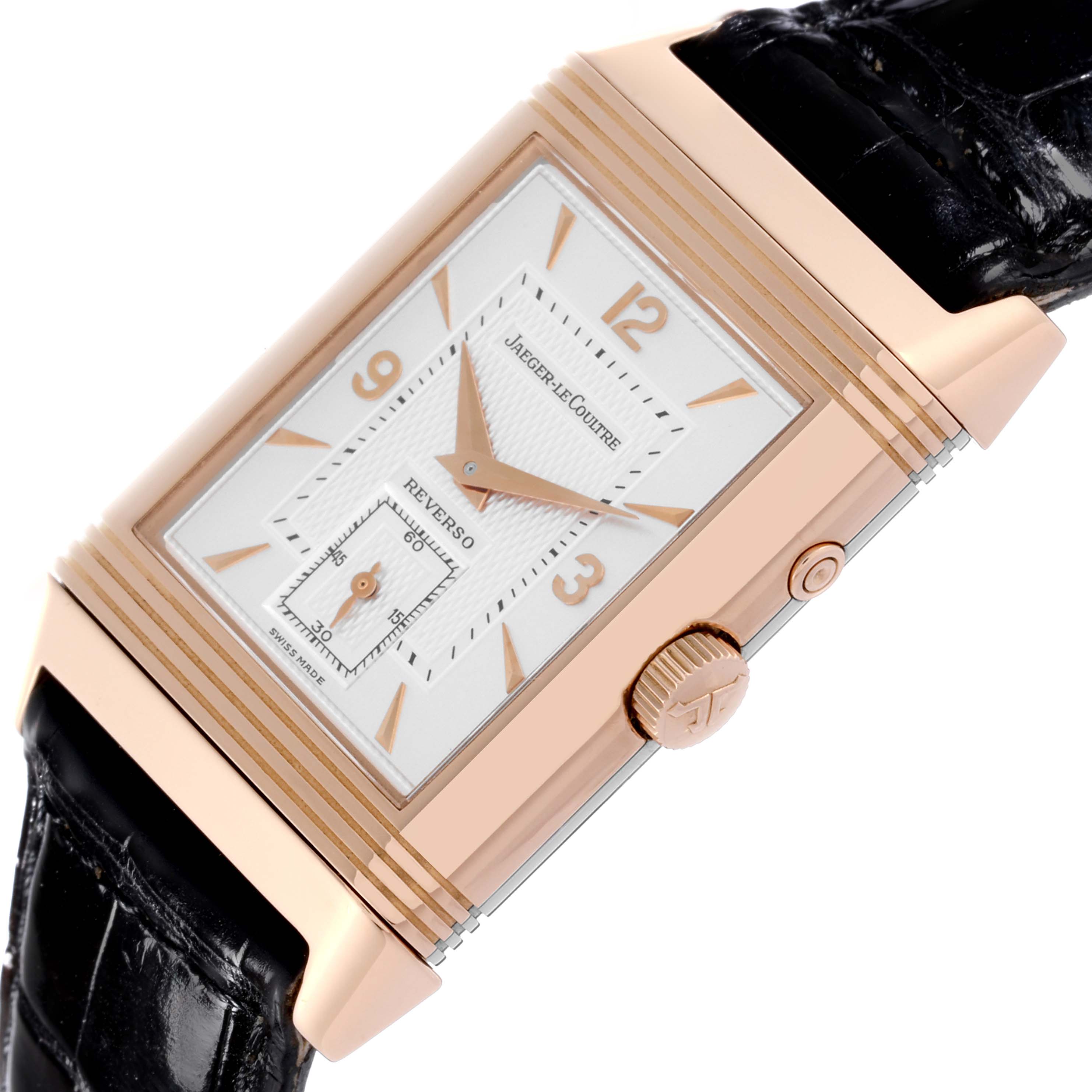 The Jaeger-LeCoultre Reverso watch is shown at a slight angle, highlighting the crown, case, and strap.