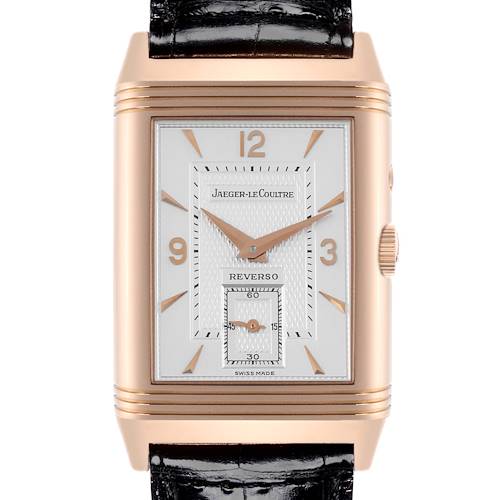 The image shows a front view of the Jaeger LeCoultre Reverso watch, highlighting the dial, hands, and crown.