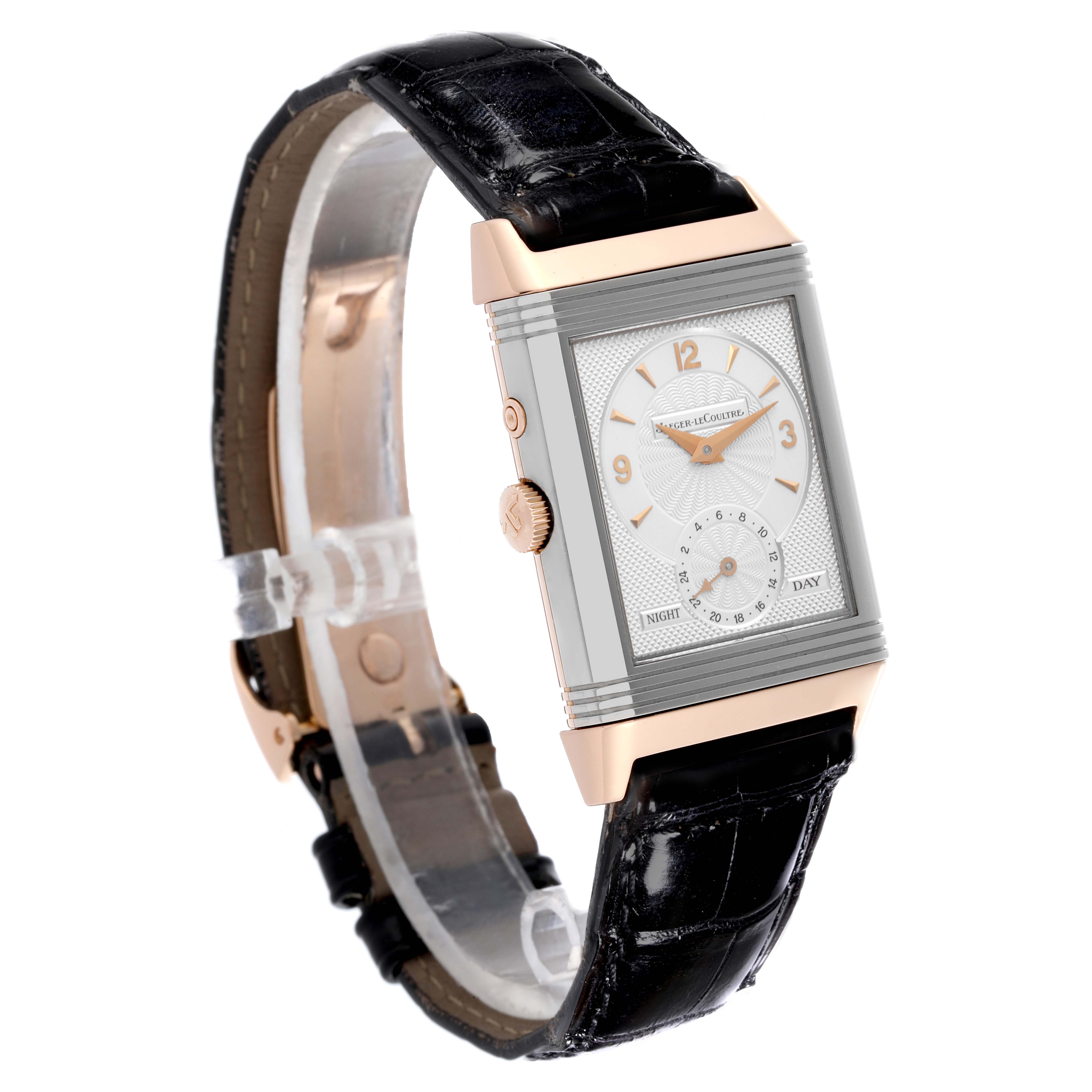 The Jaeger-LeCoultre Reverso watch is shown at an angle highlighting the face and side, featuring a leather strap and clasp.