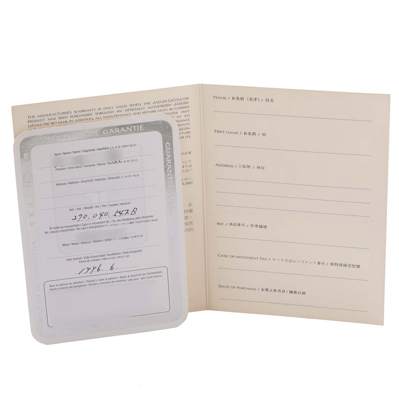 The image shows a warranty booklet for a Jaeger-LeCoultre Reverso watch, displaying its open pages.