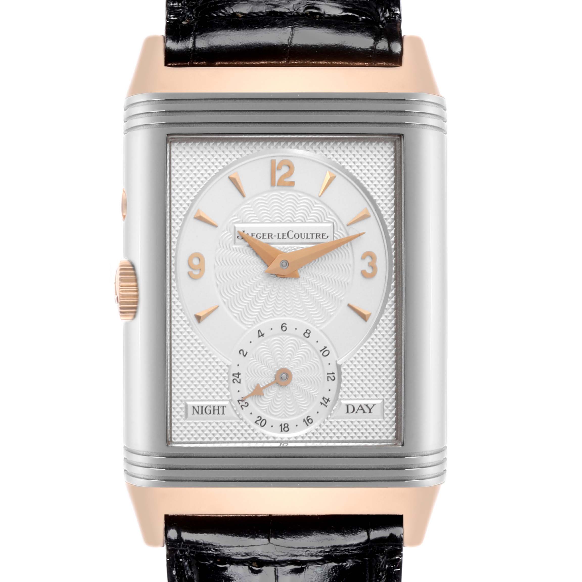 The Jaeger-LeCoultre Reverso watch is shown from the front, featuring a rectangular face with Day/Night indicator and leather strap.