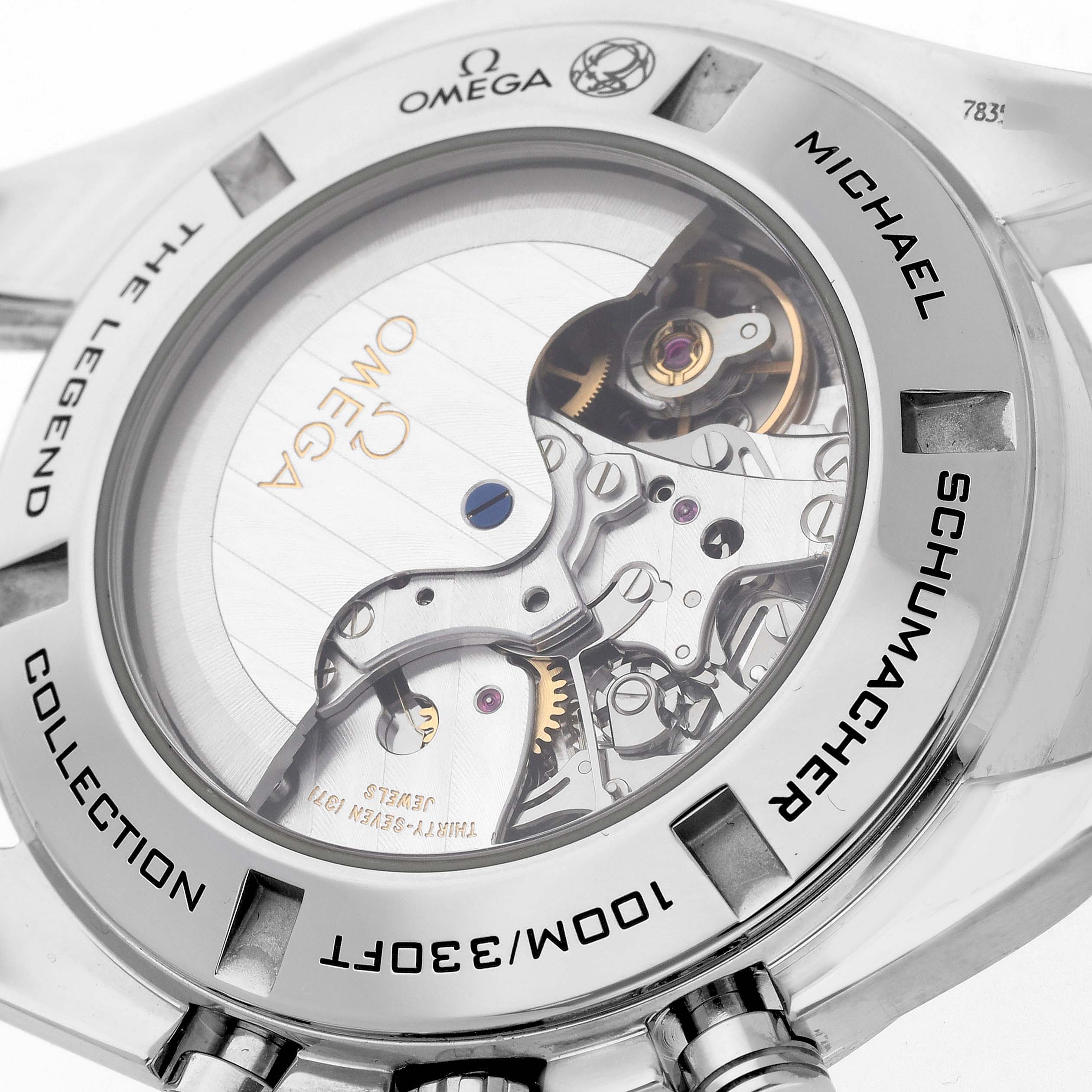 The image shows the back of an Omega Speedmaster 321.30.44.50.01.001 Men
s Stainless Steel Black Dial 321.30.44.50.01.001 Men
s Stainless Steel Black Dial, highlighting its mechanical movement and inscriptions.