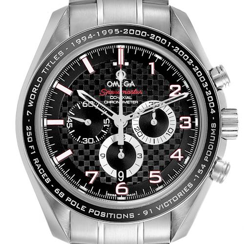 The Omega Speedmaster watch is shown from a front angle, displaying the dial, bezel, and pushers.