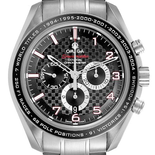 The Omega Speedmaster watch is shown from a front angle, displaying the dial, bezel, and part of the bracelet.