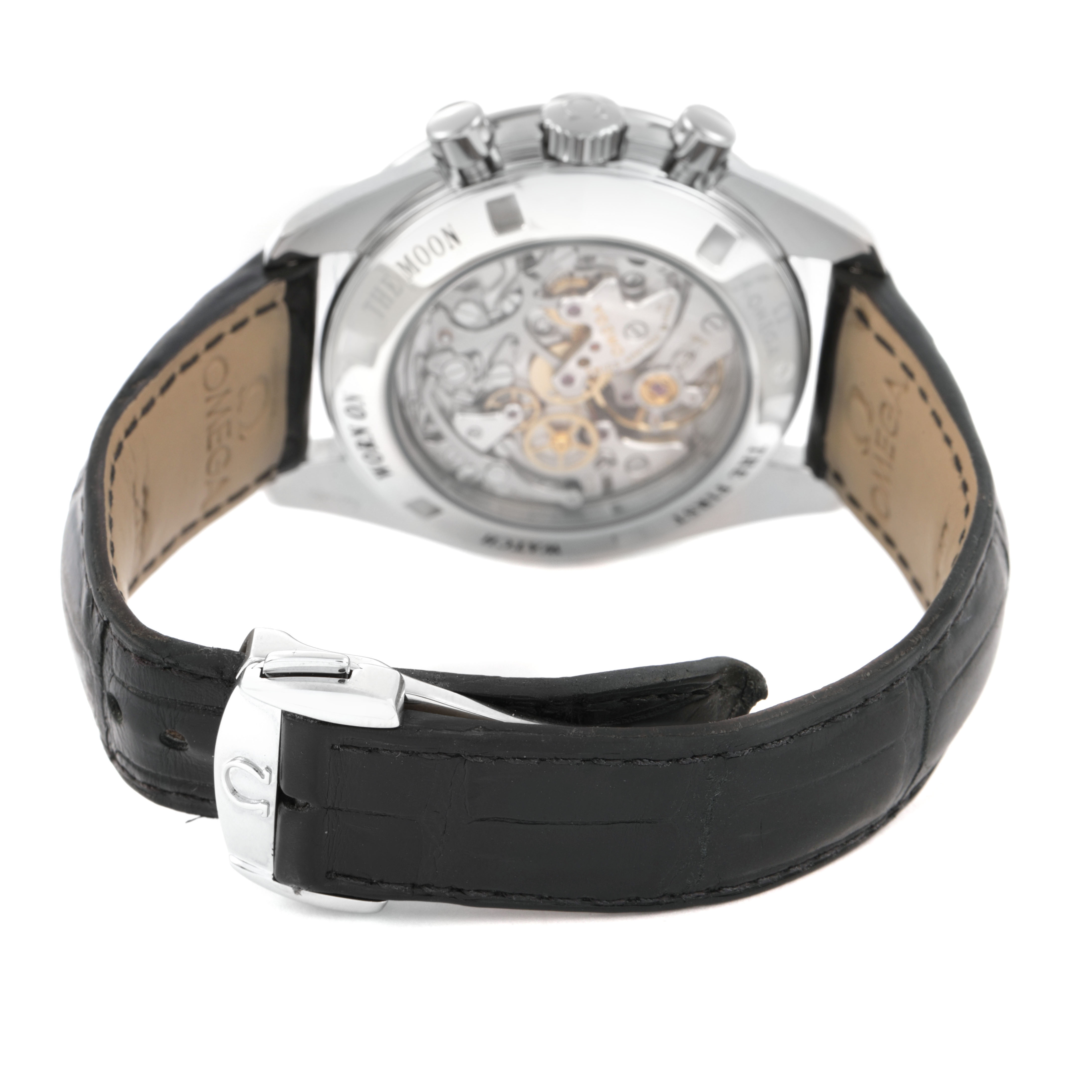 The Omega Speedmaster 310.30.42.50.01.002 Men's Stainless Steel Black Dial watch is shown from the back, highlighting the movement and black leather strap with its clasp.