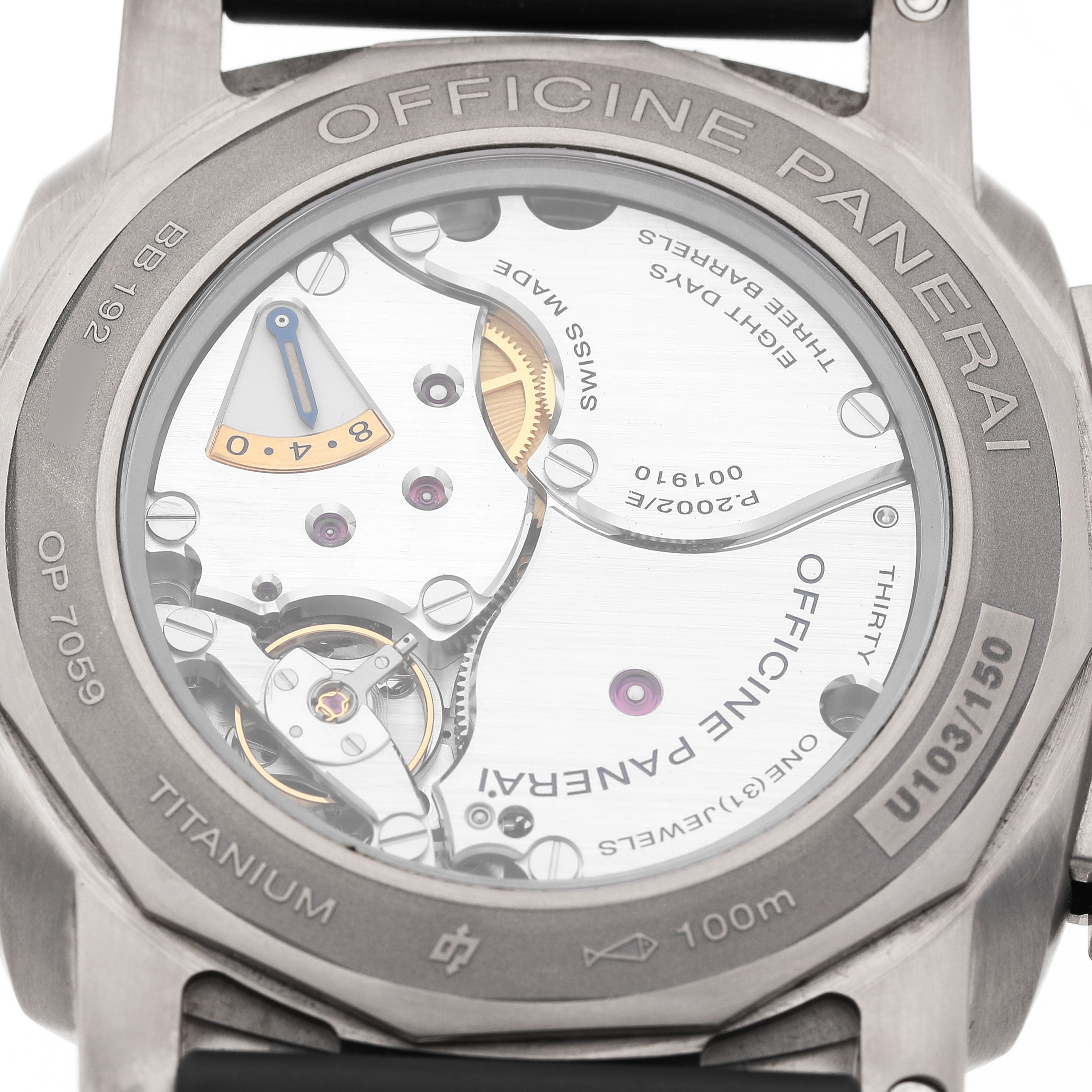 The image shows the back view of a Panerai Luminor PAM00670 Men's Titanium Blue Dial, highlighting its movement and inner mechanisms.