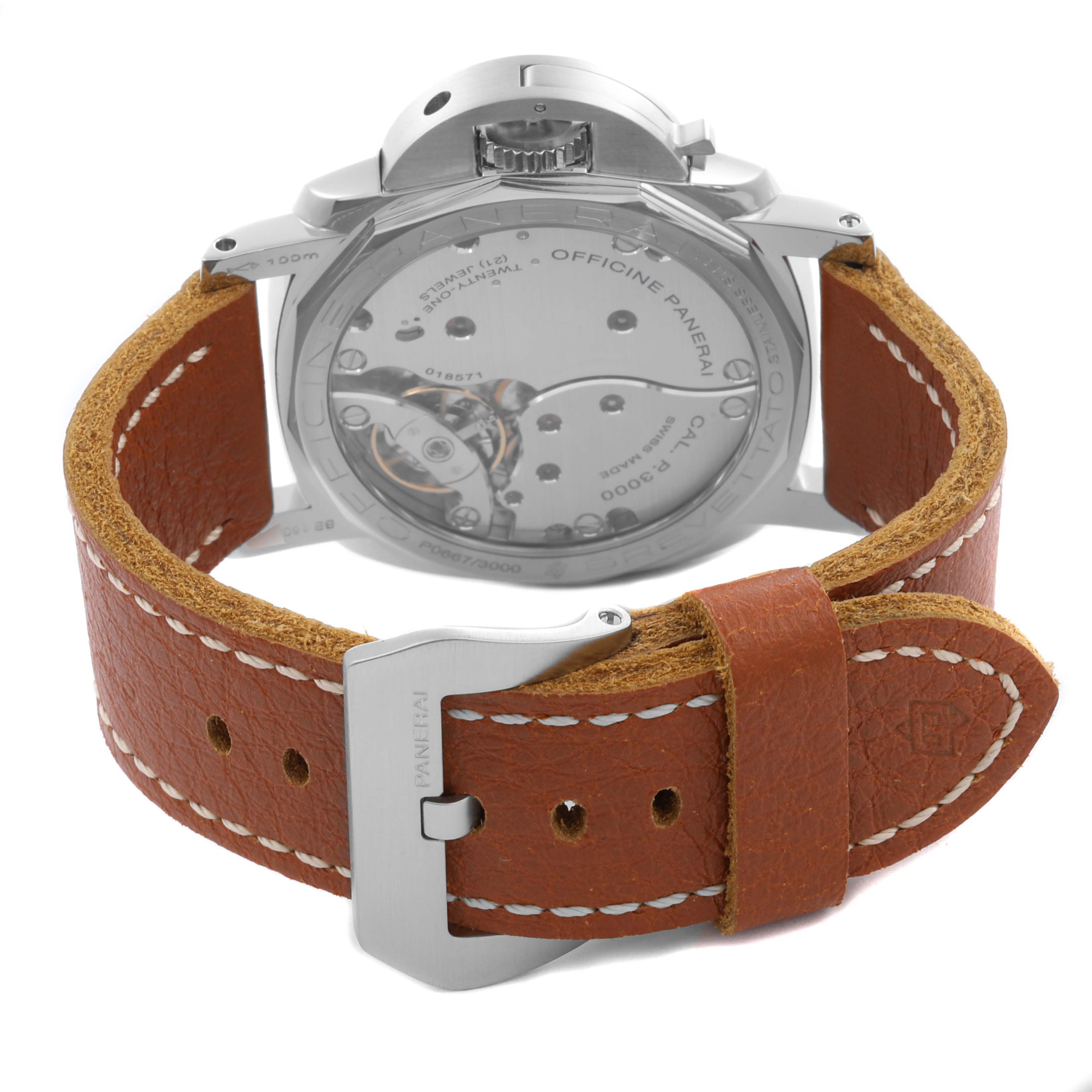 The image shows the back of a Panerai Luminor PAM00372 Men
s Stainless Steel Black Dial PAM00372 Men
s Stainless Steel Black Dial watch with its mechanical movement and brown leather strap visible.