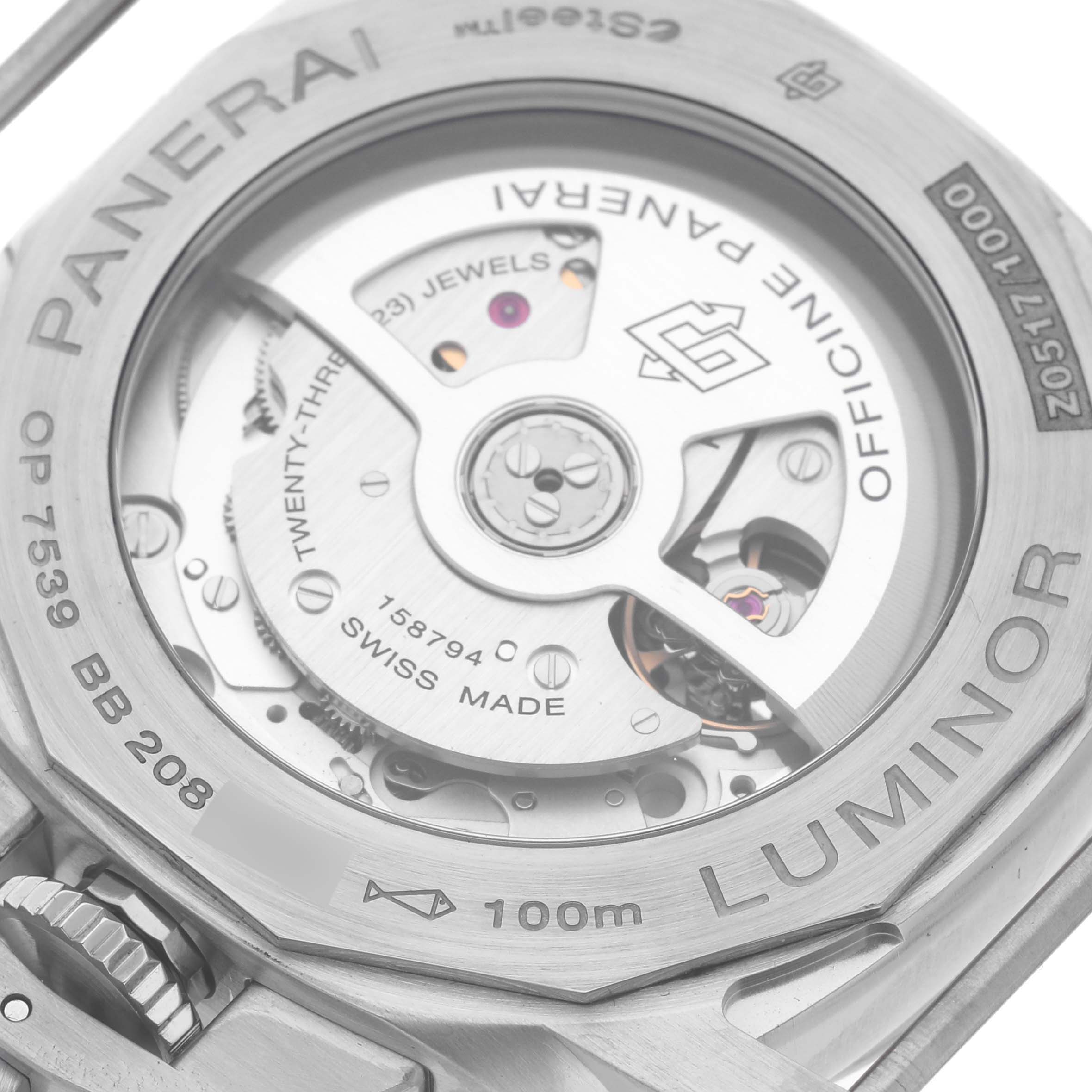 The image shows the back of a Panerai Luminor PAM01365 Men
s Stainless Steel Black Dial PAM01365 Men
s Stainless Steel Black Dial watch with its intricate movement and inscriptions visible.