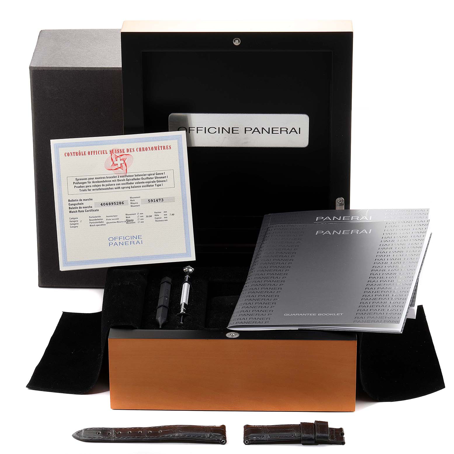 The image shows the Panerai Luminor PAM00090 Men's Stainless Steel Black Dial PAM00090 Men's Stainless Steel Black Dial model watch box, with its open lid, certification, instruction booklets, and extra straps.