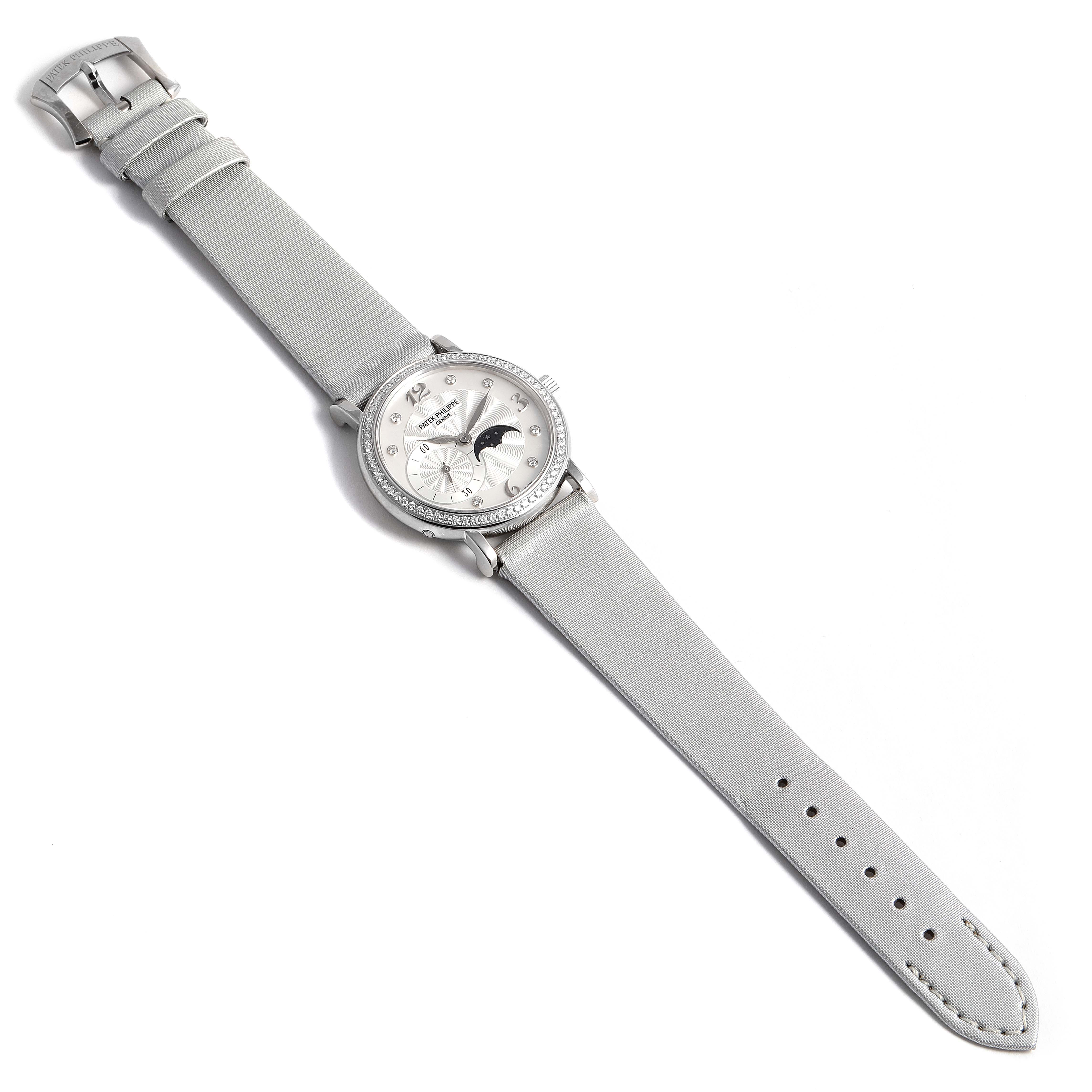 The image shows a top-down view of a Patek Philippe Calatrava 4958G Women's White Gold Mother of Pearl Dial 4958G Women's White Gold Mother of Pearl Dial watch, displaying its dial, strap, and buckle.