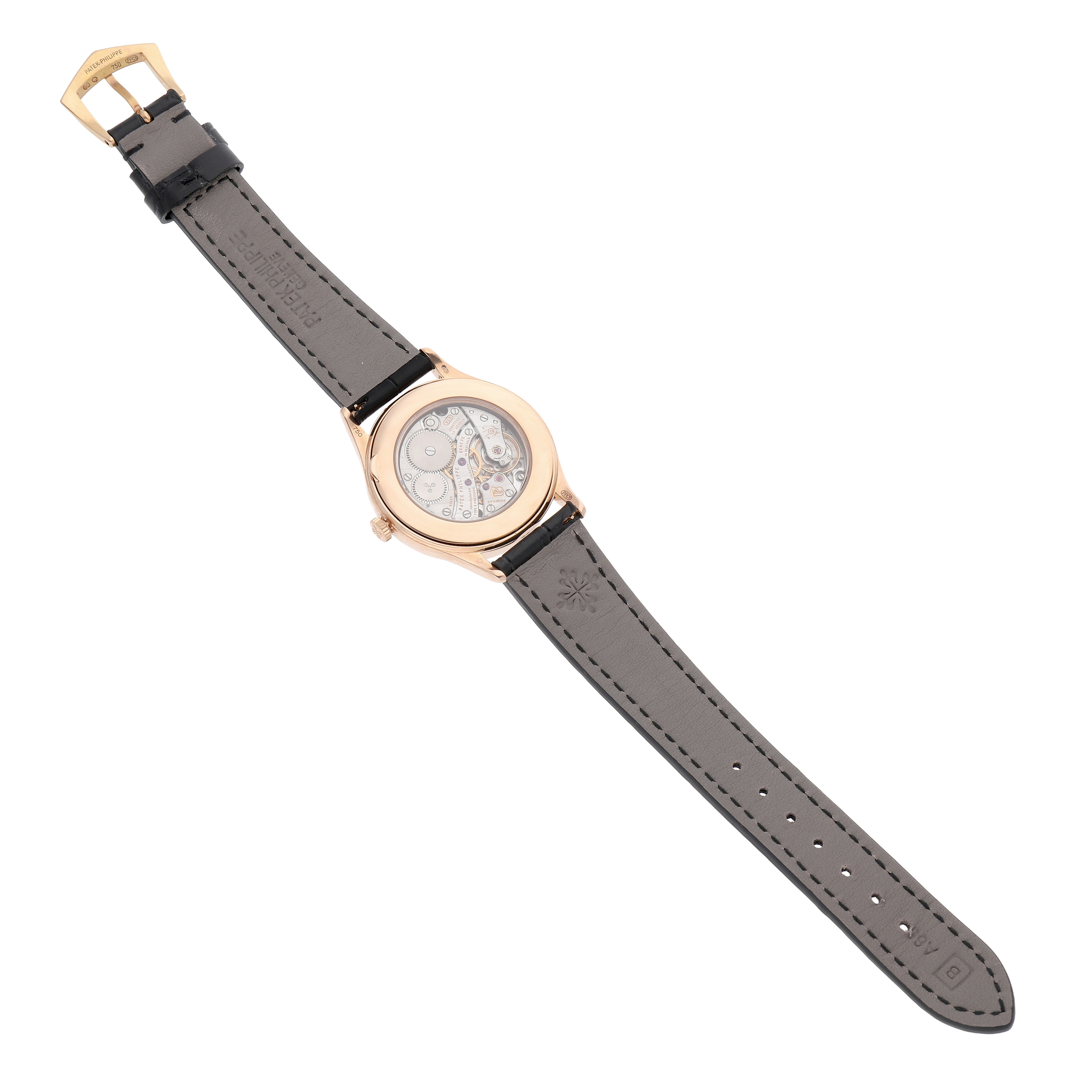The image shows the back view of a Patek Philippe Calatrava 4897R-010 Women's Rose Gold Beige Dial, displaying the movement through a transparent case back.
