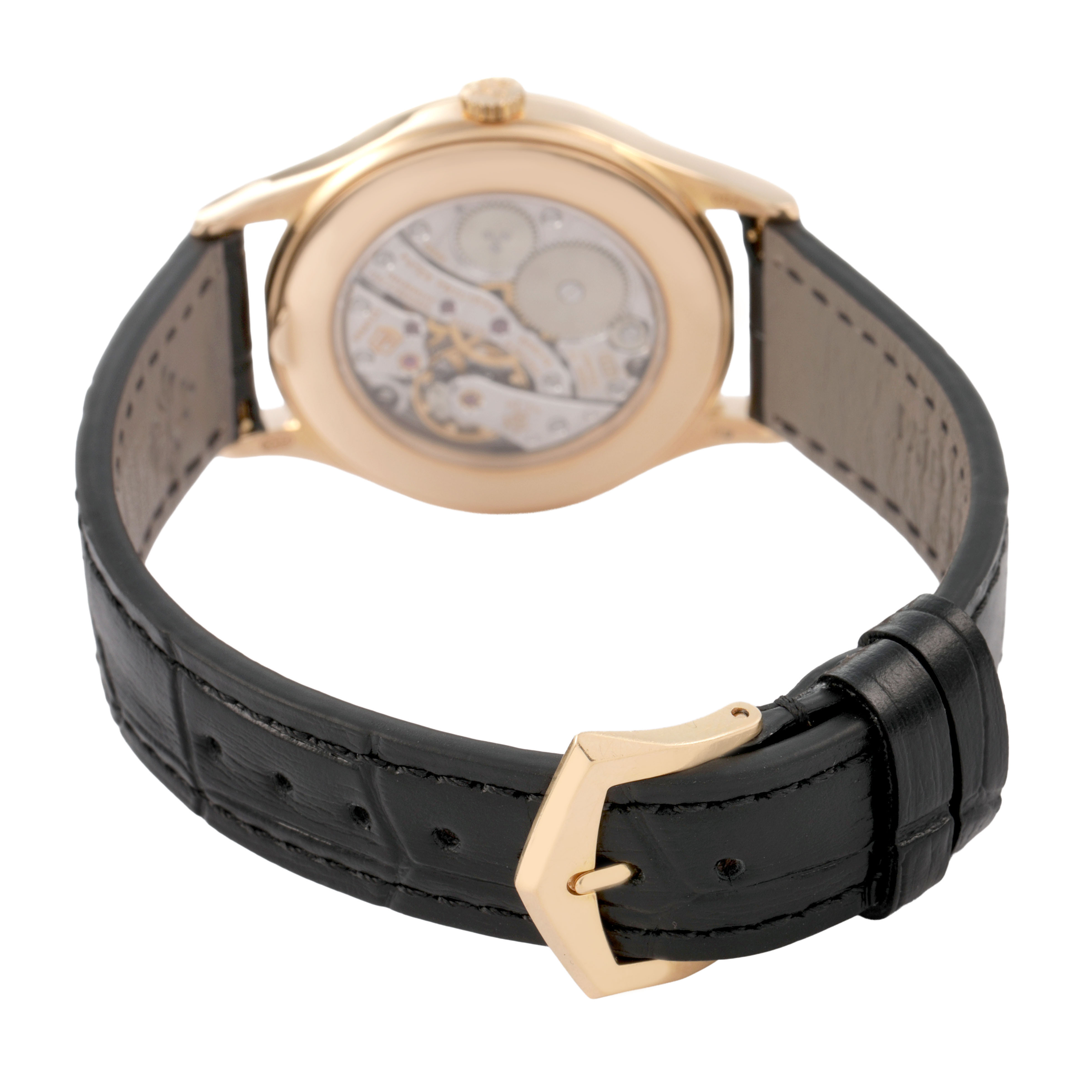 The Patek Philippe Calatrava 4897R-010 Women's Rose Gold Beige Dial watch is shown from the back angle, displaying its transparent case back and leather strap with a buckle.