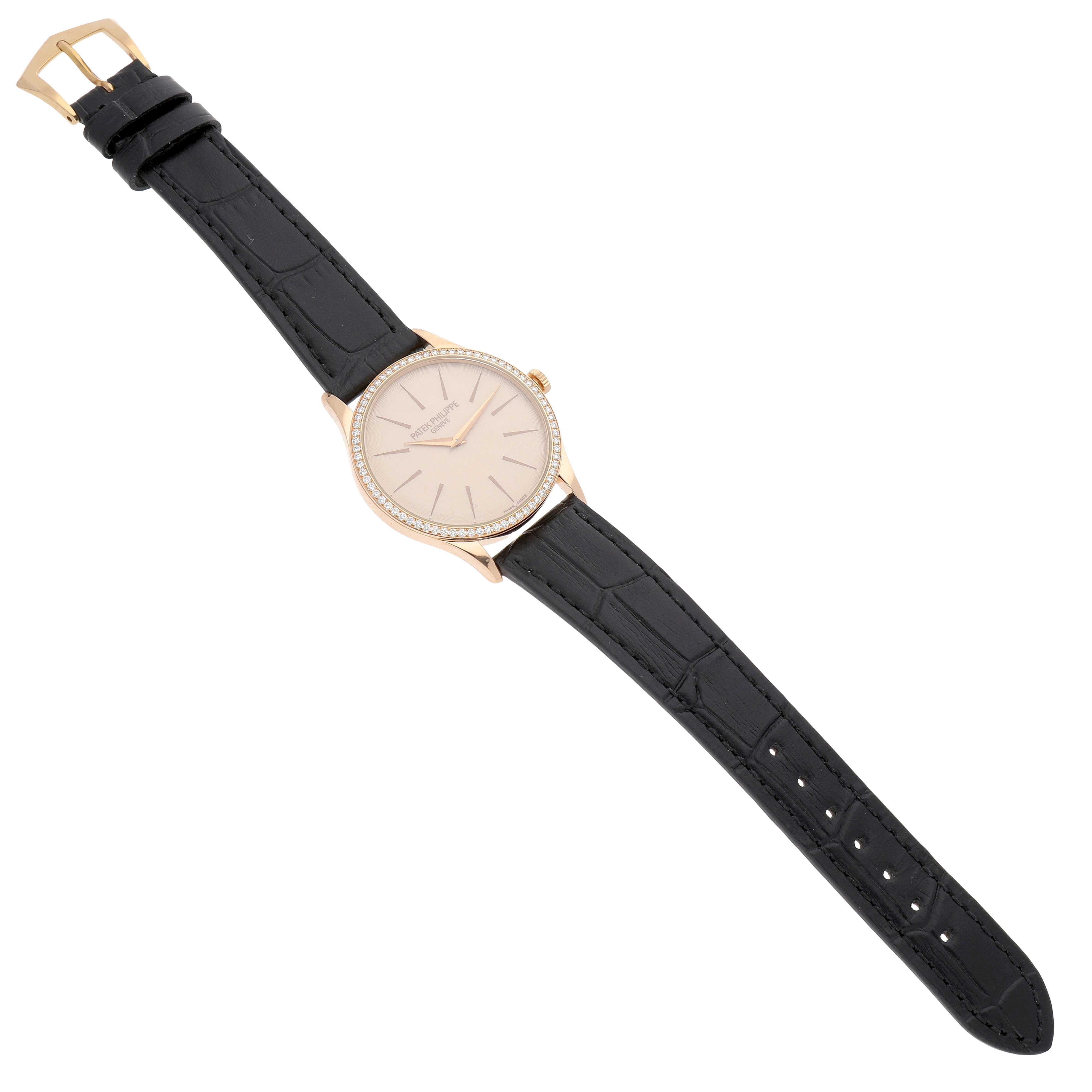 The Patek Philippe Calatrava 4897R-010 Women's Rose Gold Beige Dial watch is shown from a top view, displaying its face, bezel, and leather strap.