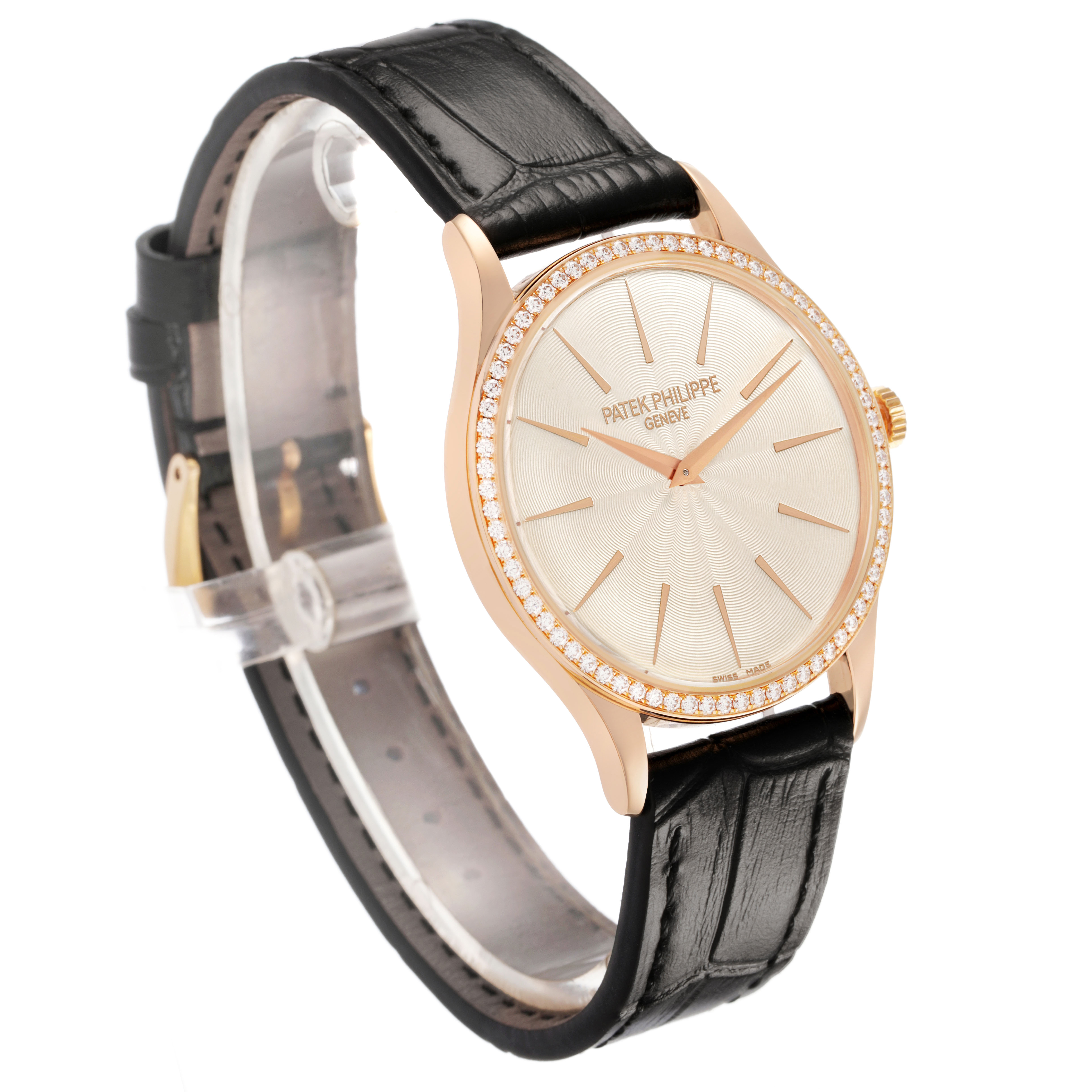 The Patek Philippe Calatrava 4897R-010 Women's Rose Gold Beige Dial watch is shown at a three-quarter angle, highlighting the dial, bezel, and leather strap.