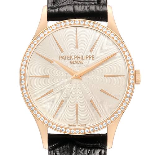 The image shows a frontal view of a Patek Philippe Calatrava 4897R-010 Women's Rose Gold Beige Dial watch, highlighting the face, bezel, and black strap.
