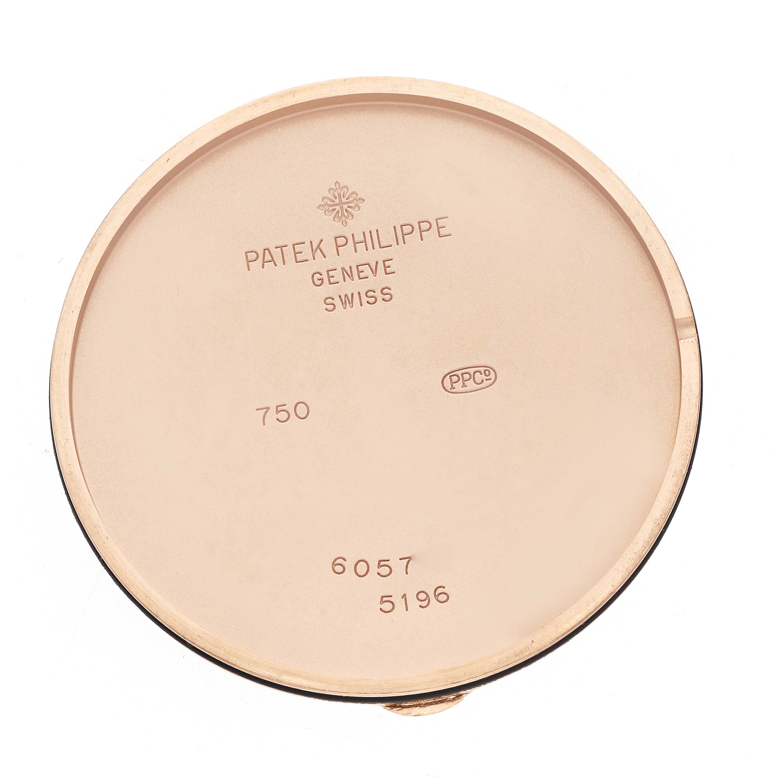 The image shows the case back of a Patek Philippe Calatrava 5196R Men
s Rose Gold Silver Dial watch, engraved with details.