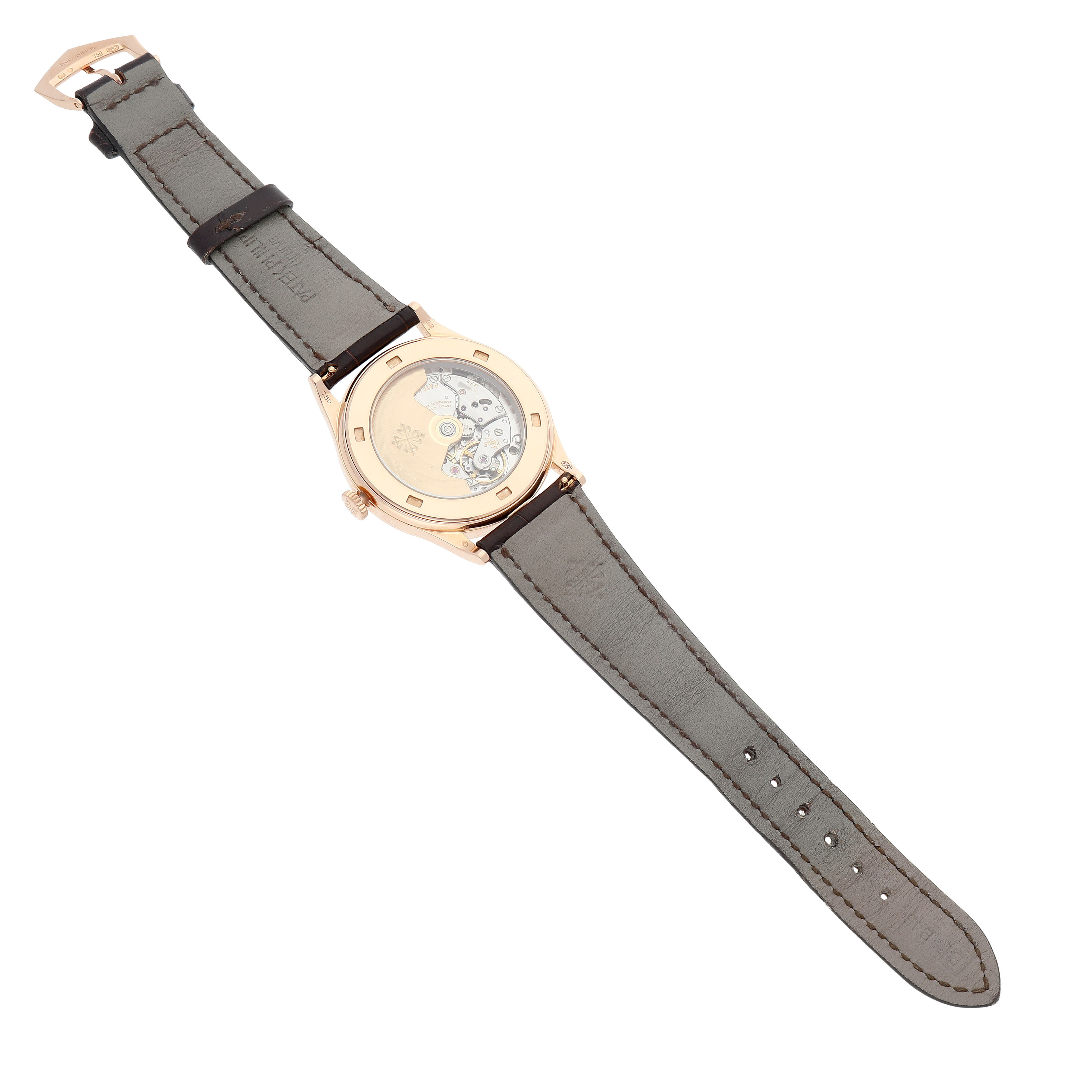 The Patek Philippe Calatrava 5296R-010 Men's Rose Gold Silver Dial watch is shown from the back, highlighting its movement and the leather strap.