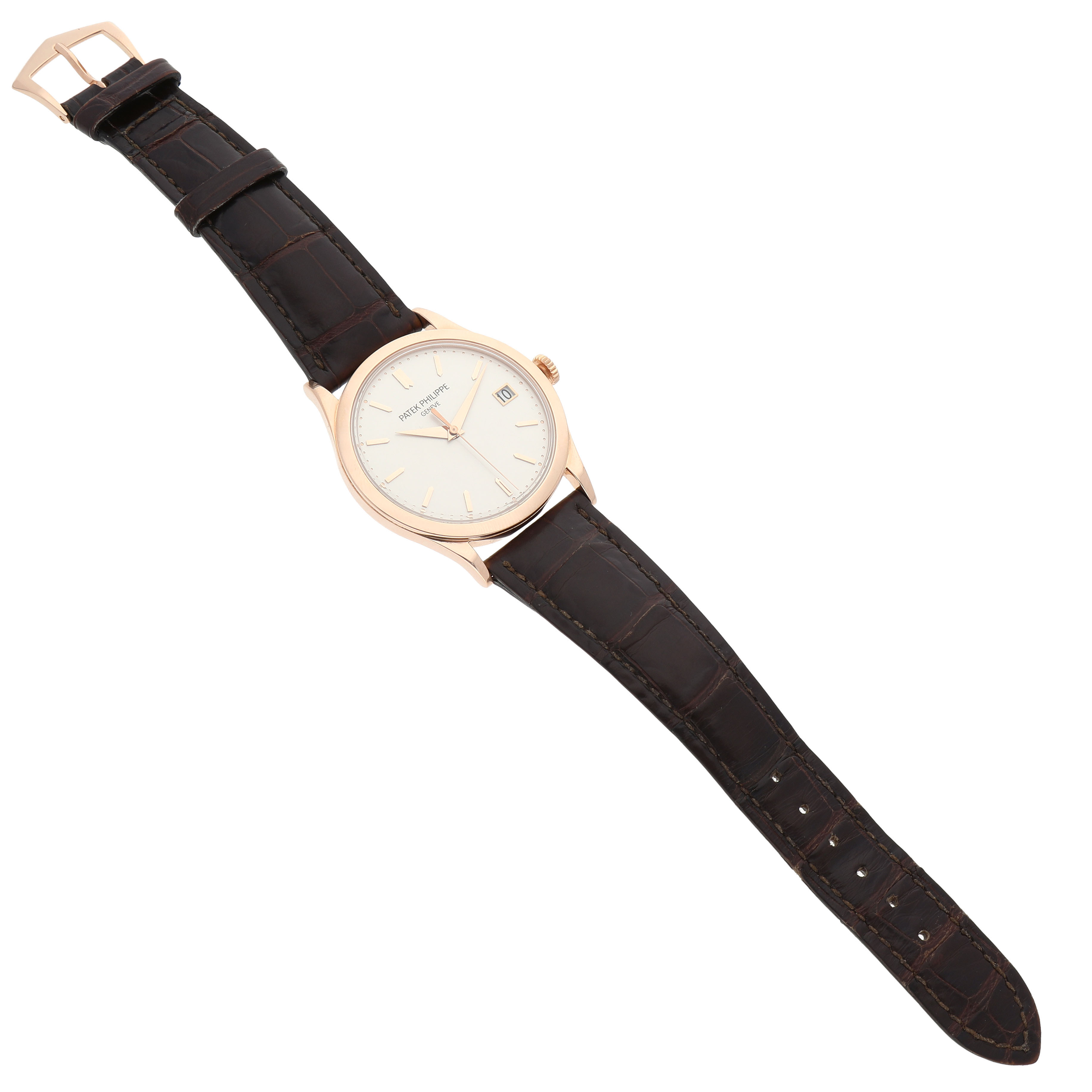 The Patek Philippe Calatrava 5296R-010 Men's Rose Gold Silver Dial watch is shown from a top-down angle, displaying its dial, straps, and buckle.