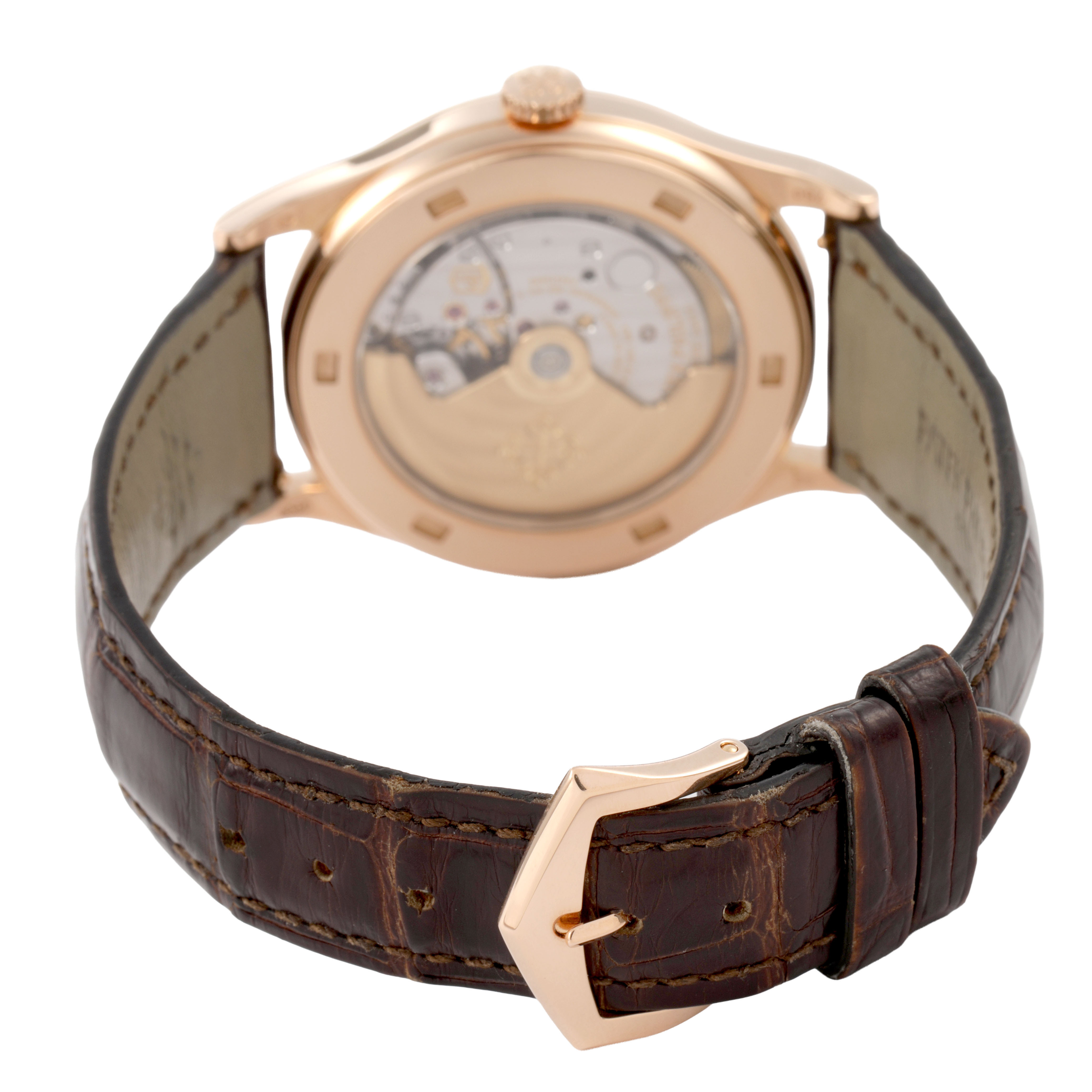 The image shows the back of a Patek Philippe Calatrava 5296R-010 Men's Rose Gold Silver Dial watch, highlighting the leather strap and gold buckle.