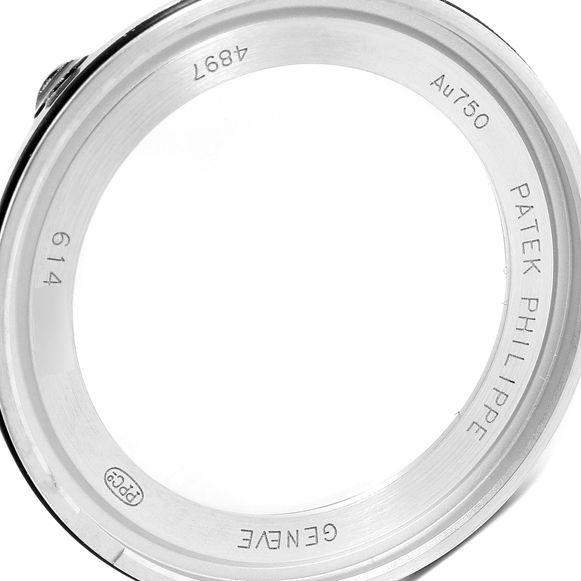 The image shows the case back of a Patek Philippe Calatrava 4897G Women's White Gold Silver Dial 4897G Women's White Gold Silver Dial watch, displaying engravings and hallmarks from an angled view.