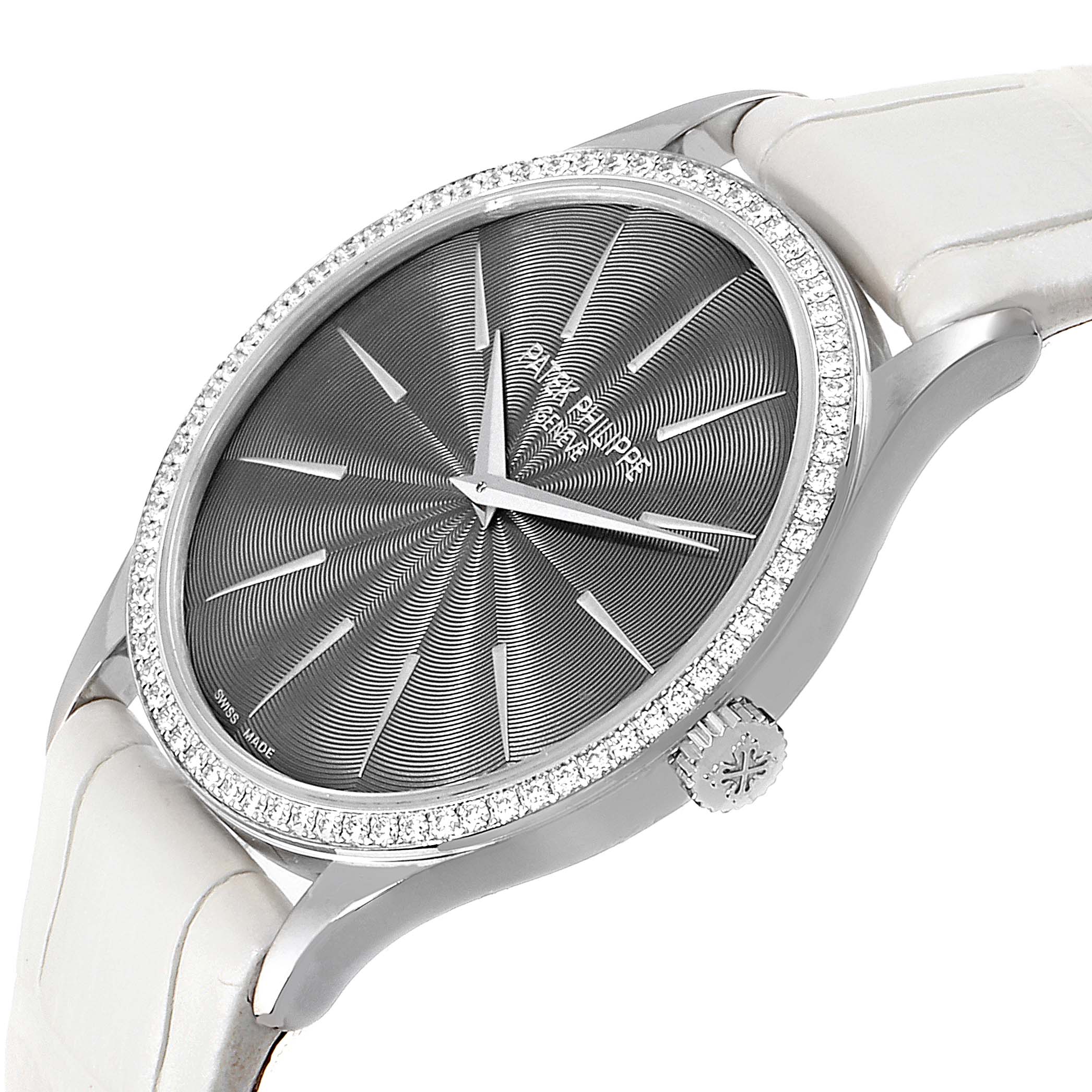 This image of the Patek Philippe Calatrava 4897G Women's White Gold Silver Dial 4897G Women's White Gold Silver Dial watch shows a close-up view of the dial, bezel, and part of the strap at an angle.