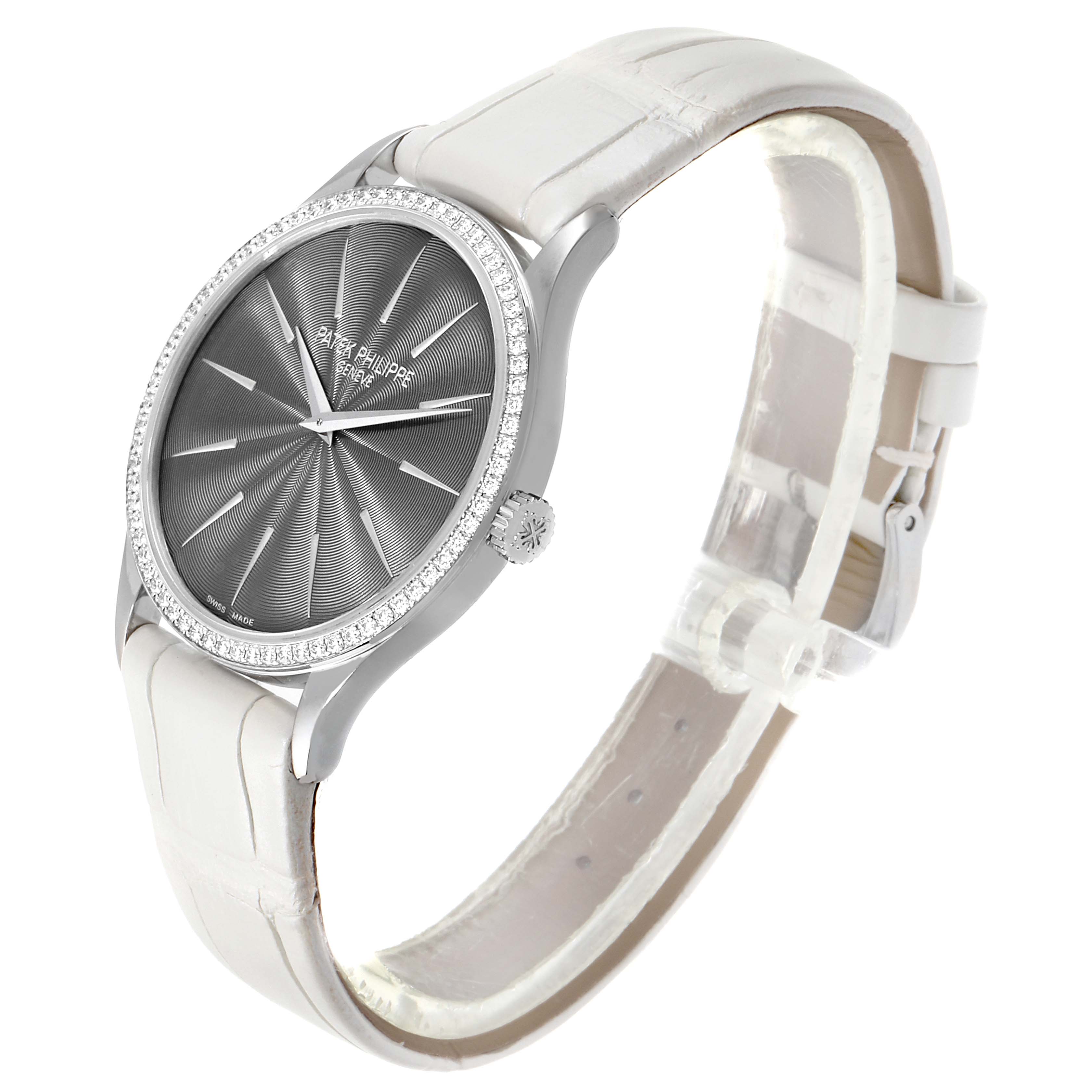 The image shows a Patek Philippe Calatrava 4897G Women's White Gold Silver Dial 4897G Women's White Gold Silver Dial watch at an angle highlighting its face, bezel, crown, and leather strap.