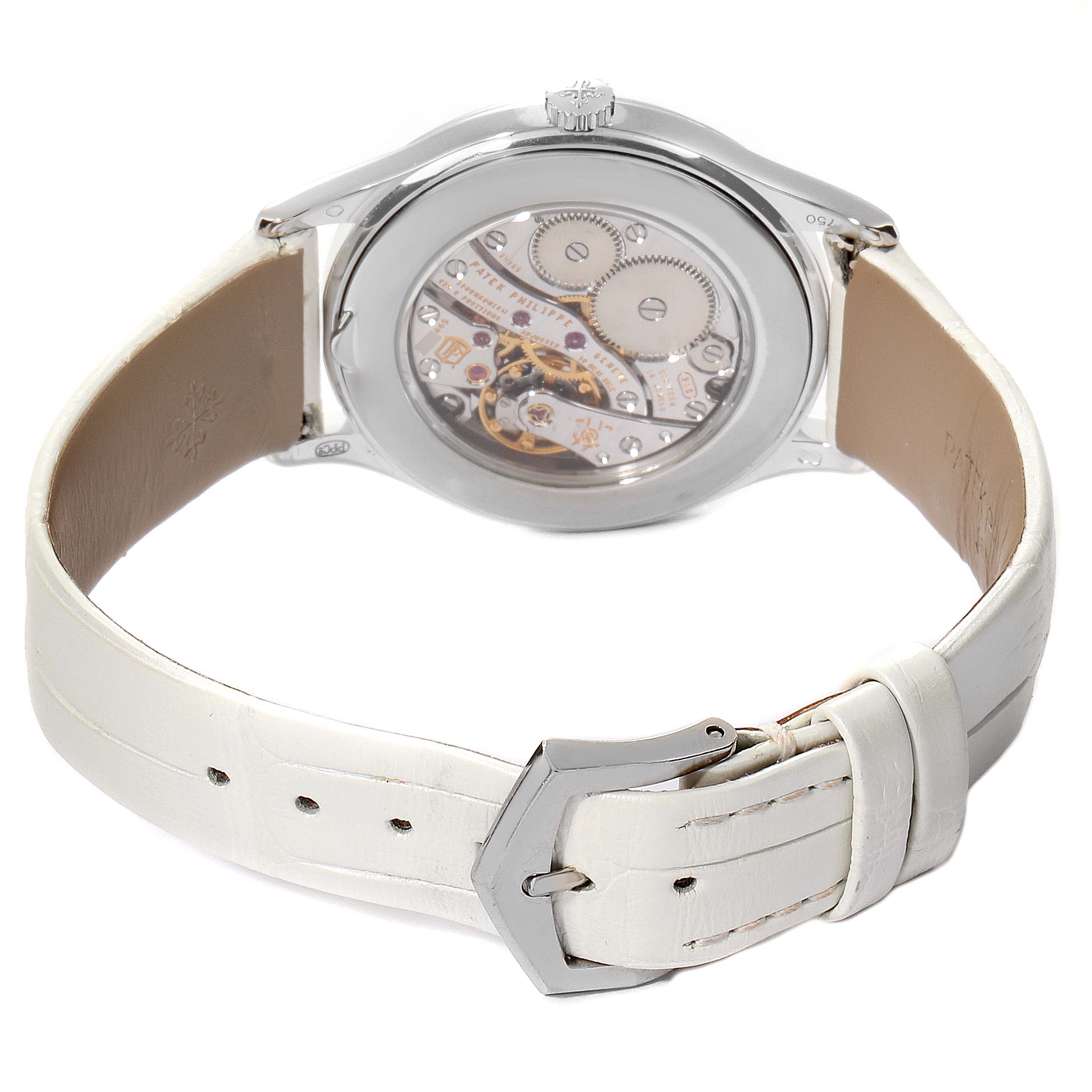The image shows the back view of a Patek Philippe Calatrava 4897G Women's White Gold Silver Dial 4897G Women's White Gold Silver Dial watch with a white leather strap and visible mechanical movement.