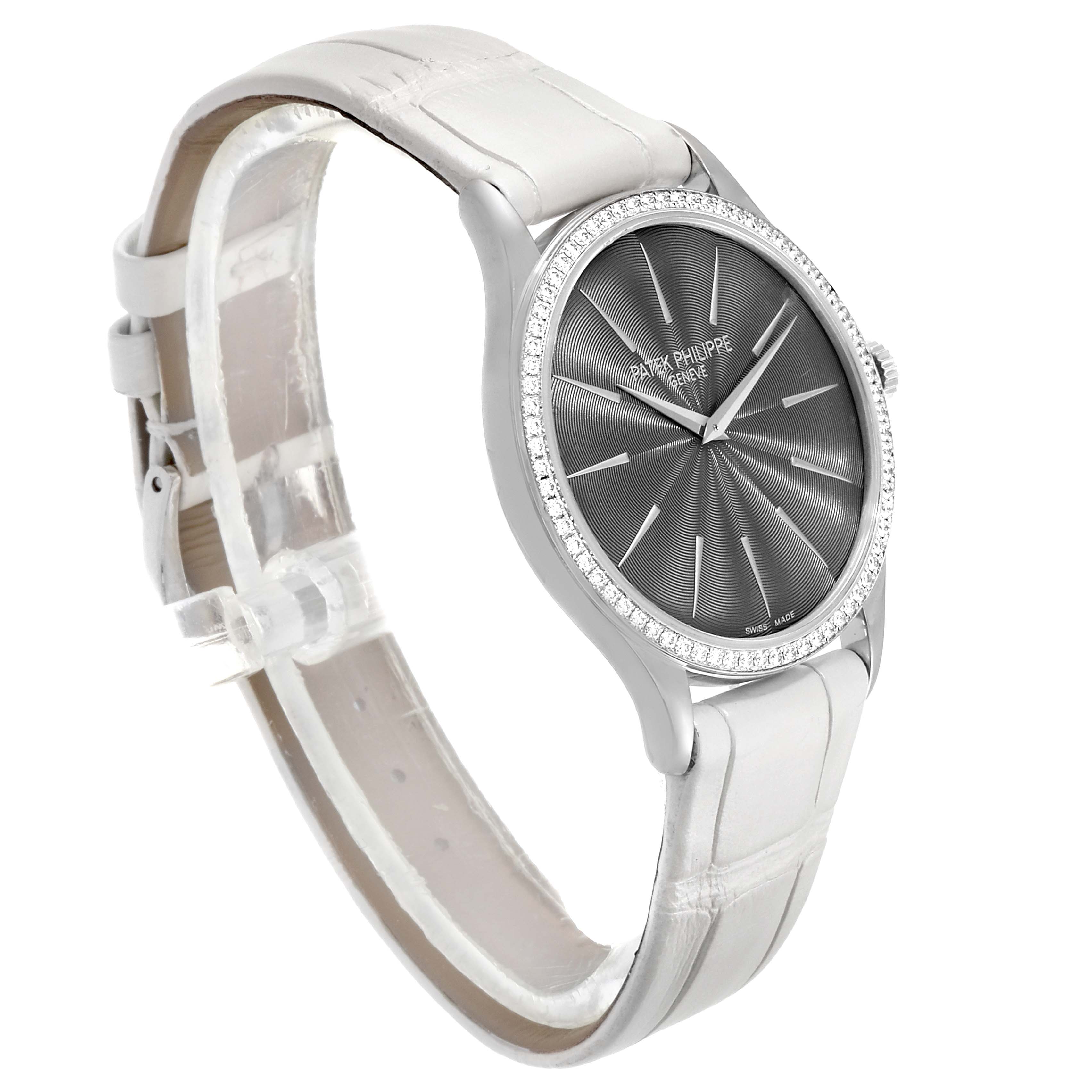 The image shows a Calatrava model by Patek Philippe at an oblique angle highlighting its dial, bezel, and strap.