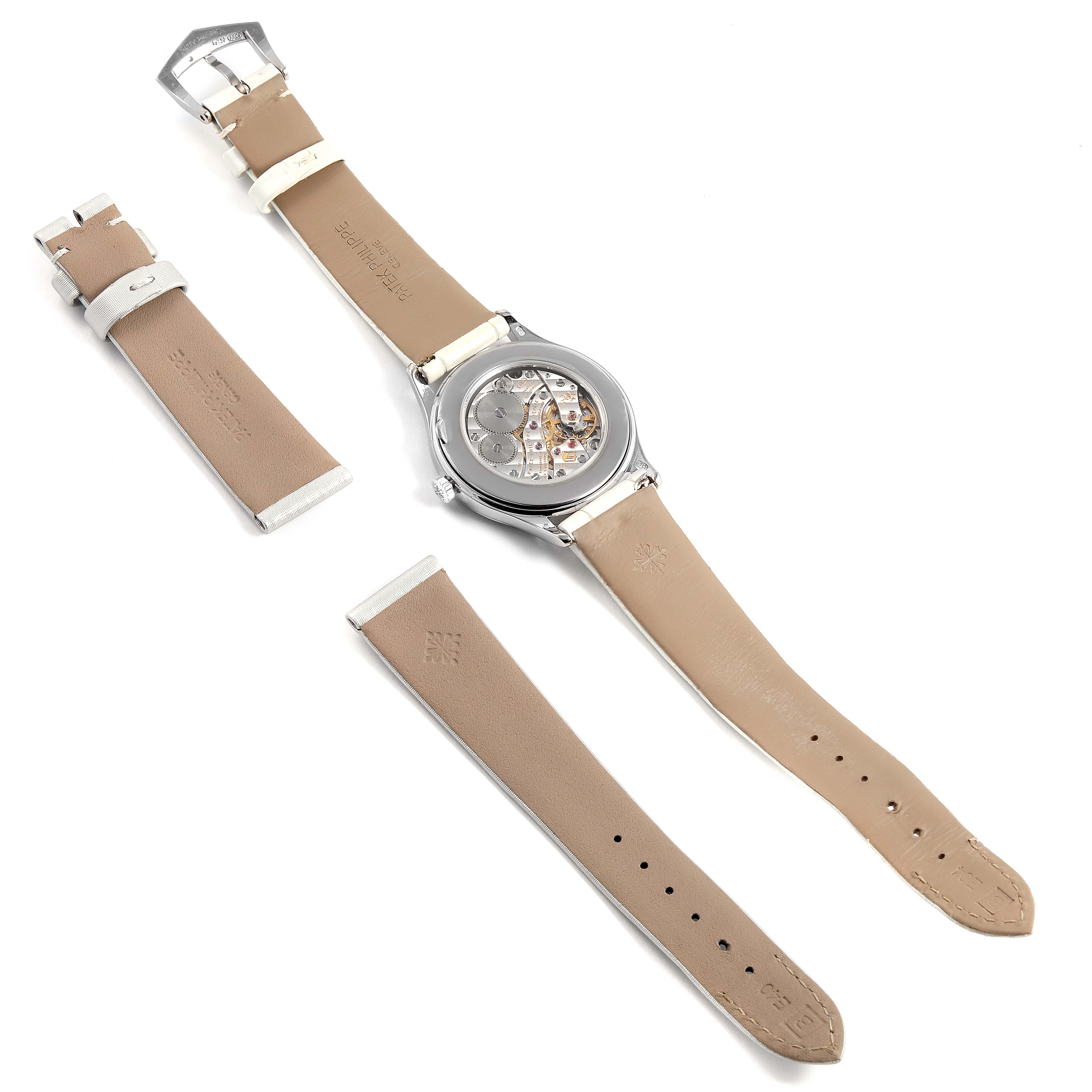 This image shows the back view of a Patek Philippe Calatrava 4897G Women's White Gold Silver Dial 4897G Women's White Gold Silver Dial watch, the leather straps, and a separate buckle.