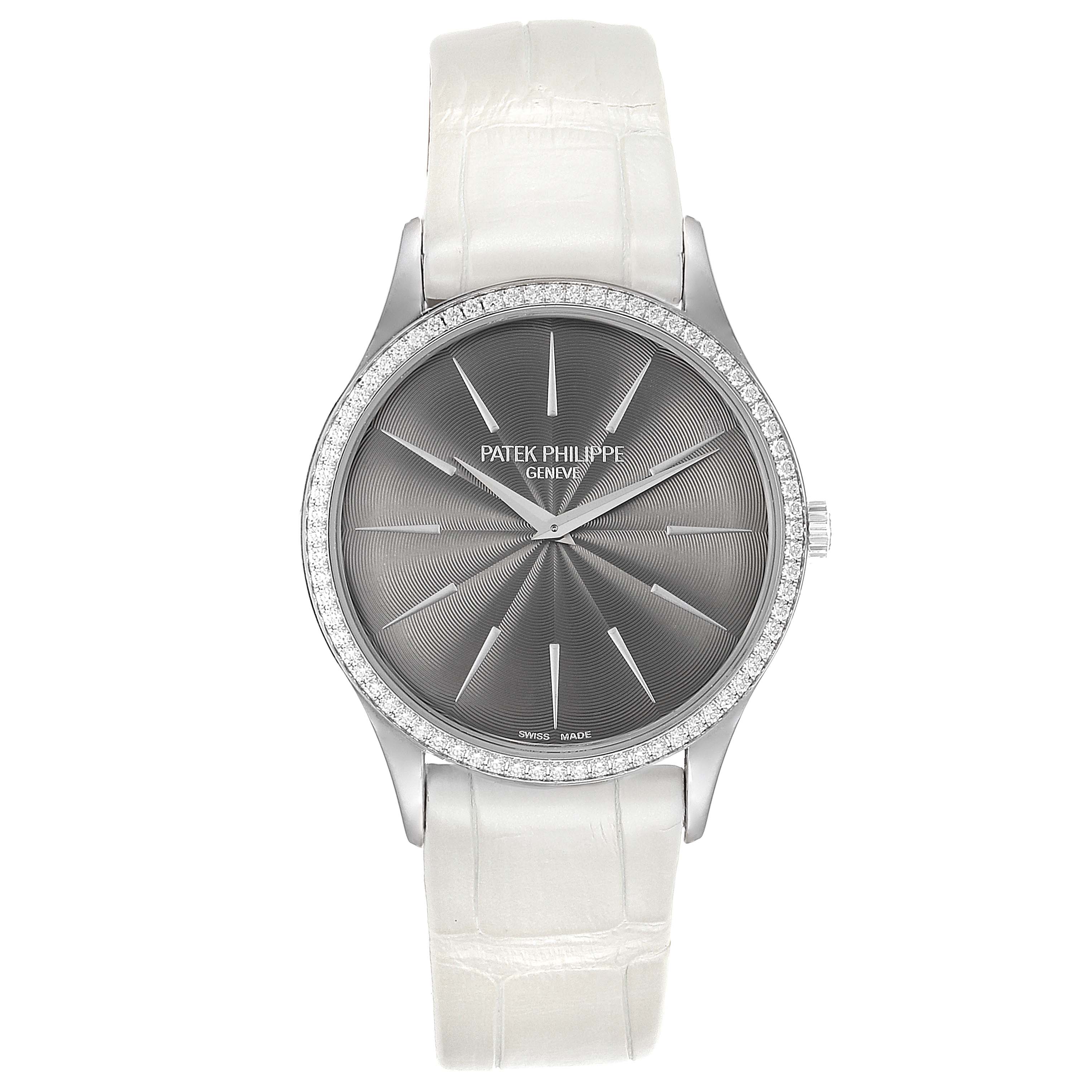 The image shows a front view of the Patek Philippe Calatrava 4897G Women's White Gold Silver Dial 4897G Women's White Gold Silver Dial watch with a white leather strap and a diamond bezel.