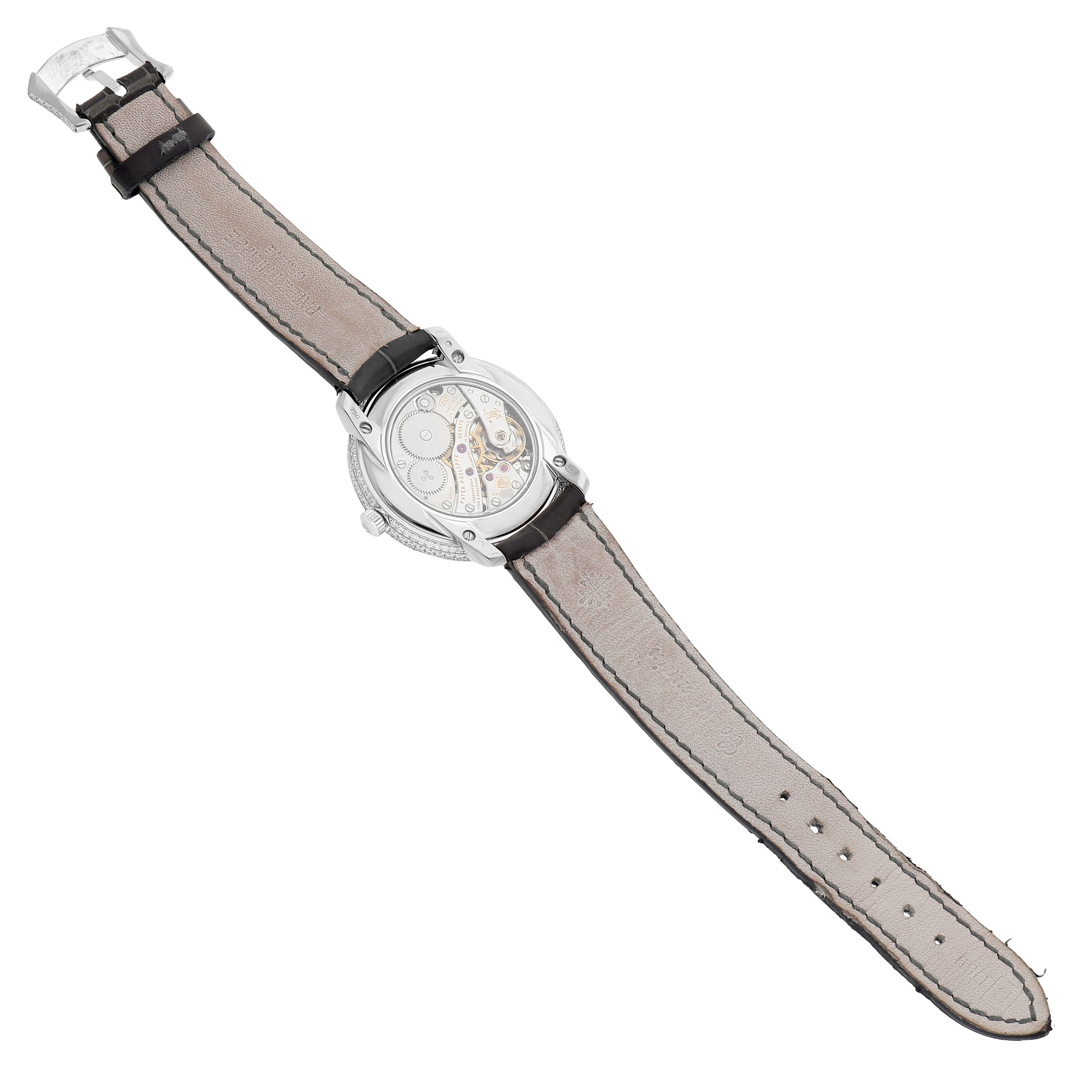 The Patek Philippe Complications 4968G-001 Women's White Gold Mother of Pearl Dial watch is shown from the back, displaying its movement and leather strap.