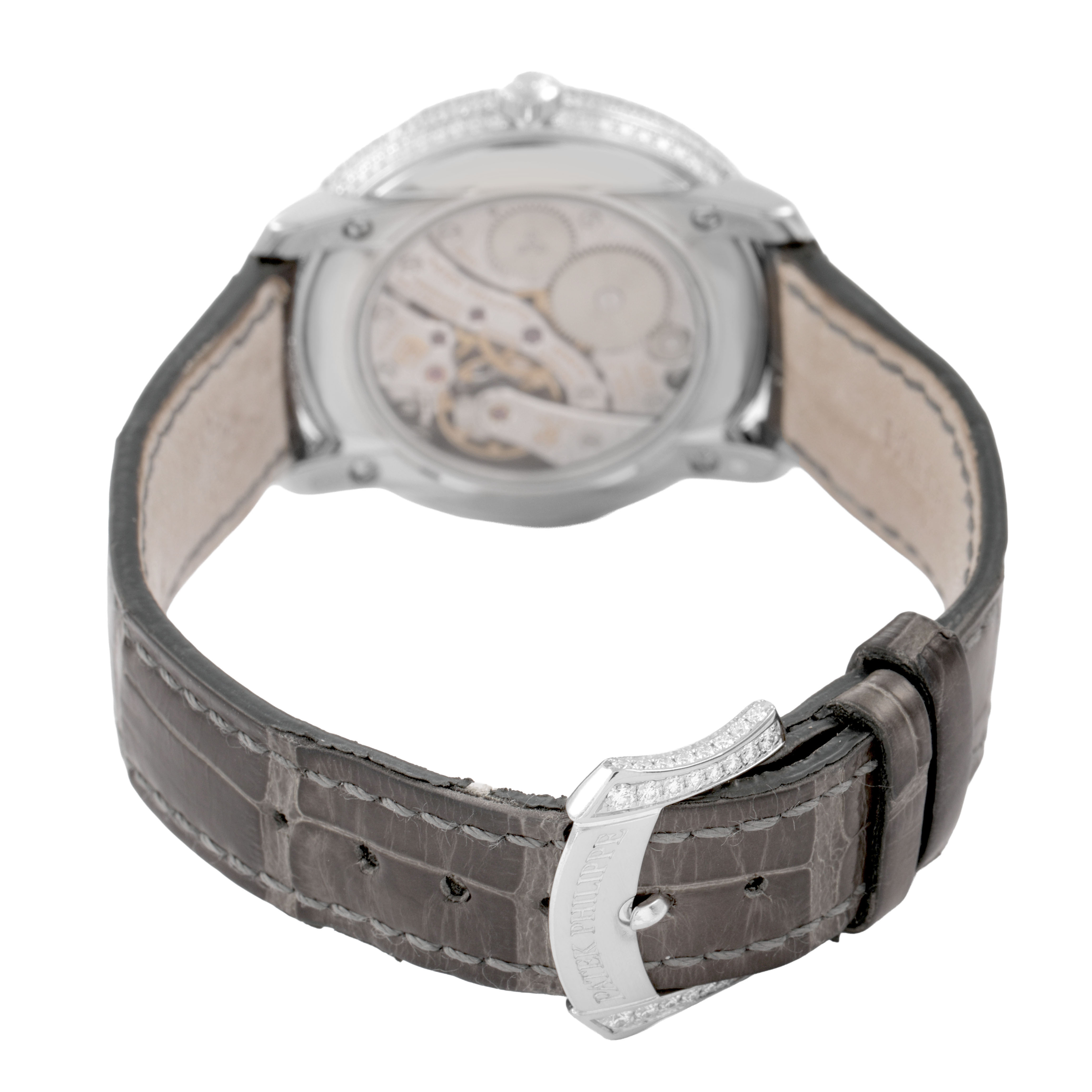 The Patek Philippe Complications 4968G-001 Women's White Gold Mother of Pearl Dial model is shown from the back, highlighting the movement and the leather strap with buckle.