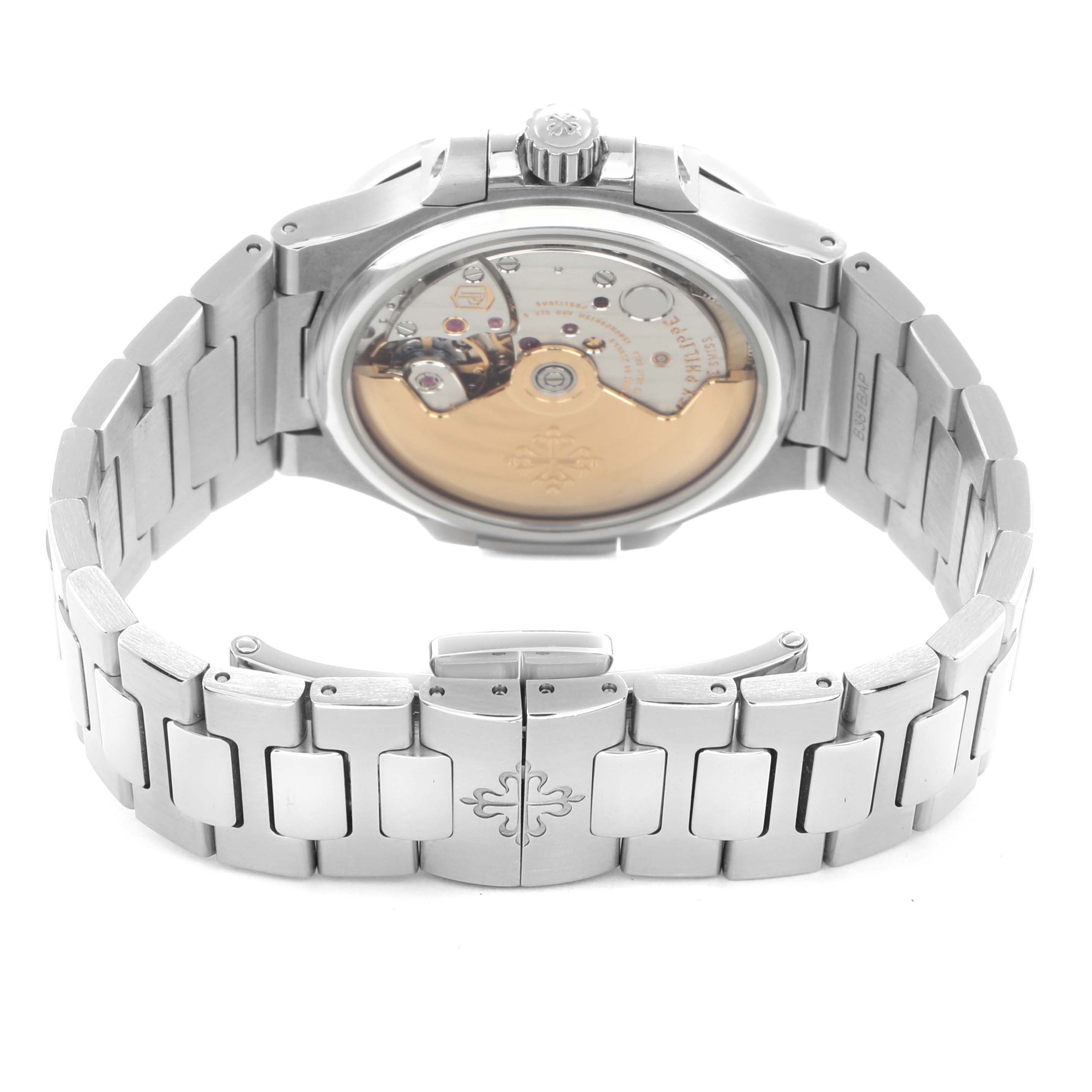 The image shows the back view of a Patek Philippe Nautilus 7008A Women
s Stainless Steel Silver Dial watch, highlighting the movement and bracelet clasp.