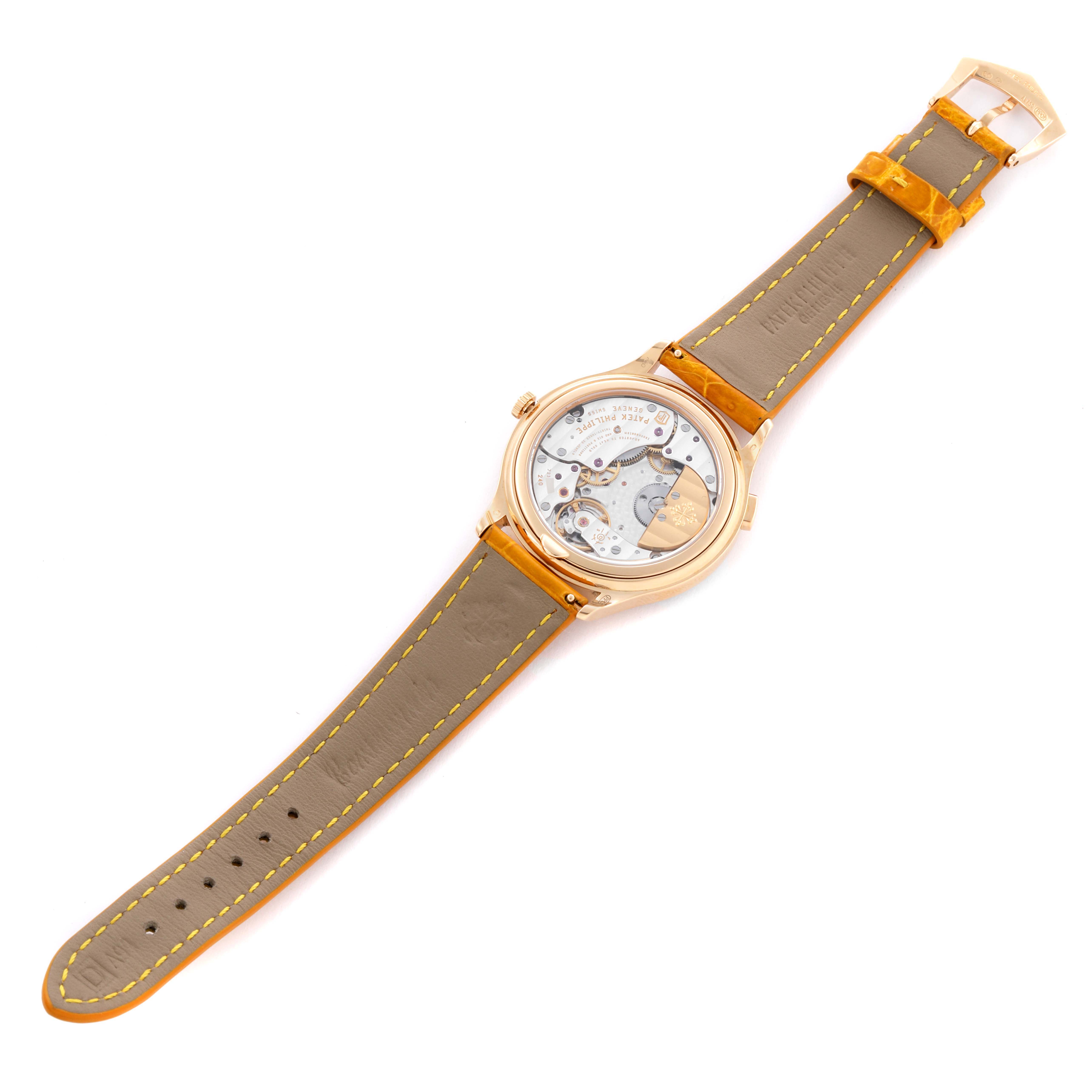 The image shows a Patek Philippe Complications 7130R-013 Men's Rose Gold Silver Dial model watch from the back, highlighting its movement and leather strap.