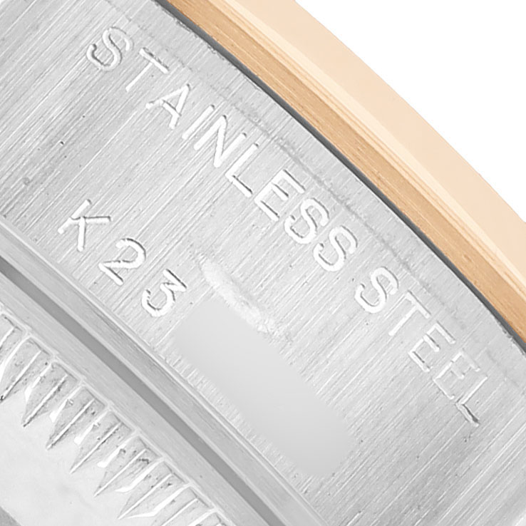 The image shows a close-up of the engraved stainless steel case back of a Rolex Datejust 79163 Women's Steel and Gold (two tone) White Dial watch.
