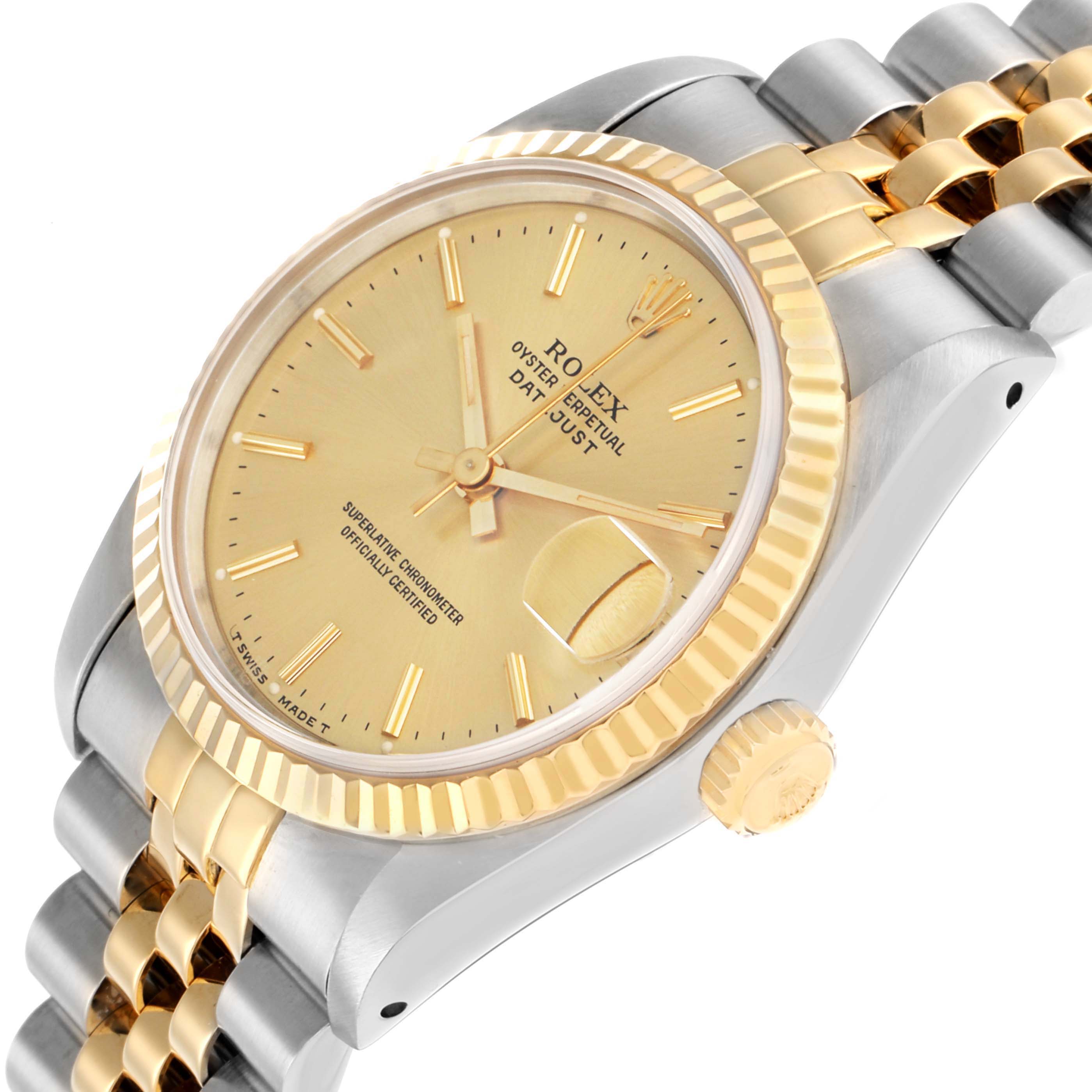 The image shows a side angle of the Rolex Mid-Size 68273 Women
s Steel and Gold (two tone) Champagne Dial watch, highlighting the crown, bezel, face, and bracelet.