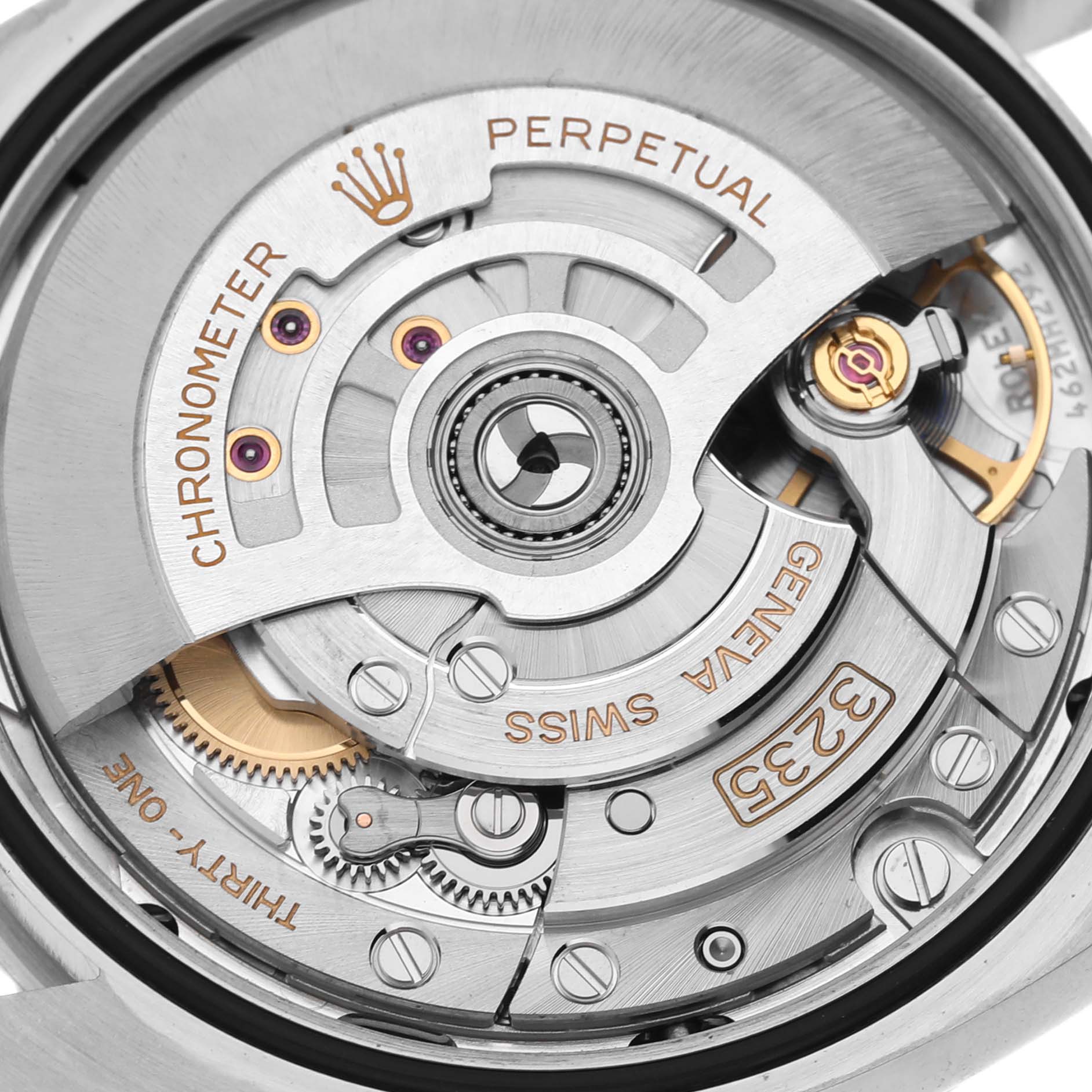 The image shows the movement mechanism of a Rolex Datejust 126200 Men's Stainless Steel Green Dial 126200 Men's Stainless Steel Green Dial watch, highlighting the rotor and gear components from a close angle.